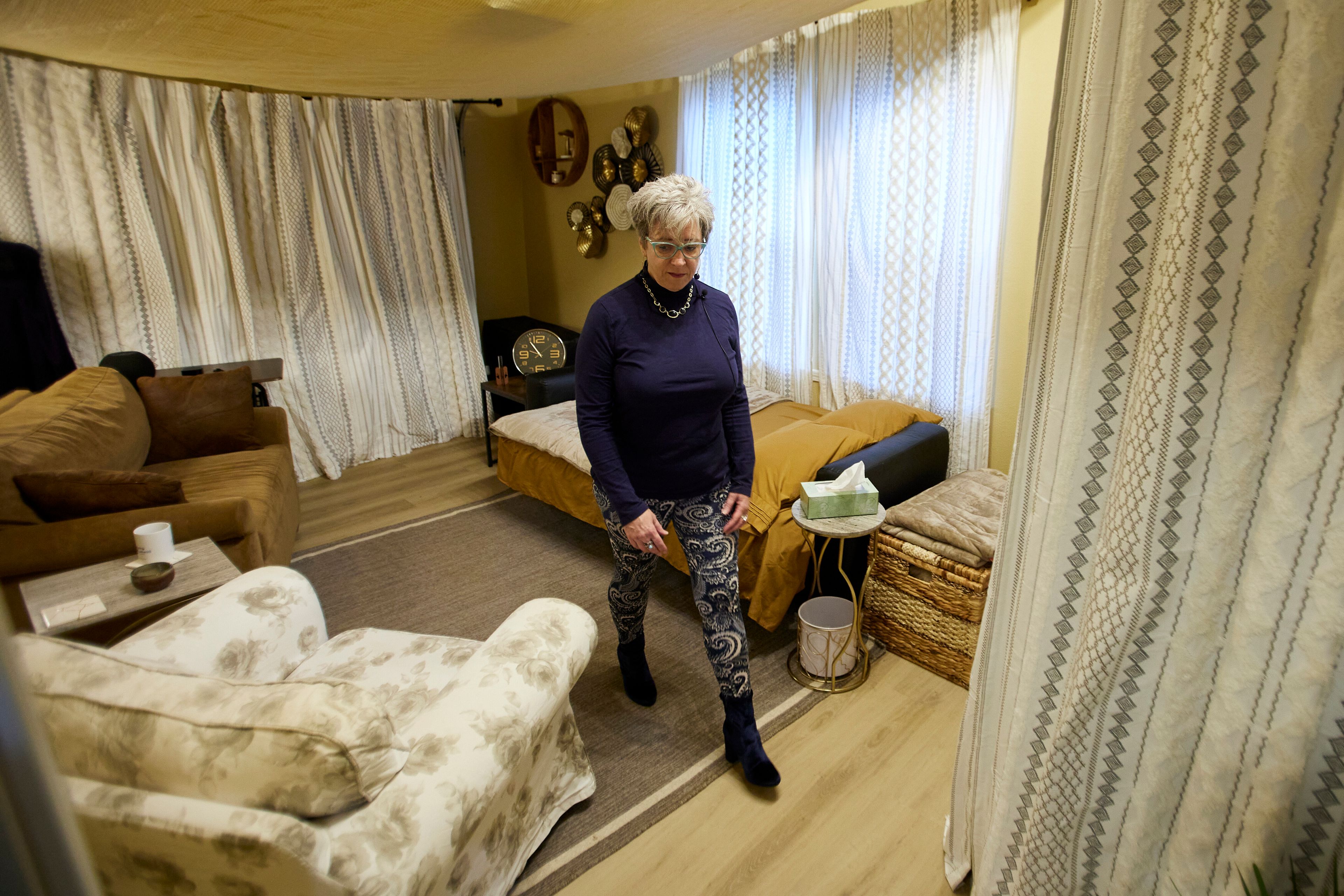 MJ Wilt, a licensed psilocybin facilitator and the owner of a licensed psilocybin service center, walks out of a room for a patient journey at her facility in Gresham, Ore., Monday, Nov. 18, 2024. (AP Photo/Craig Mitchelldyer)