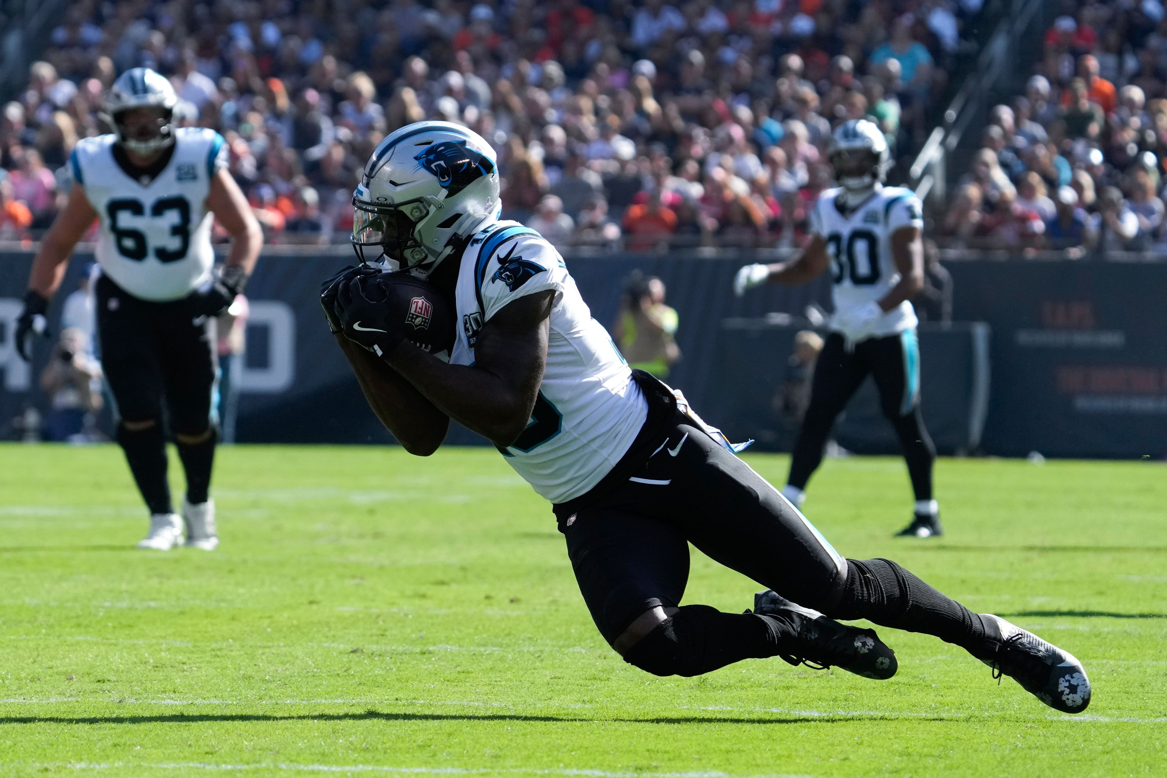 Carolina Panthers wide receiver Jonathan Mingo (15) catches a pass against the Chicago Bears during the second half of an NFL football game Sunday, Oct. 6, 2024, in Chicago. (AP Photo/Nam Y. Huh)