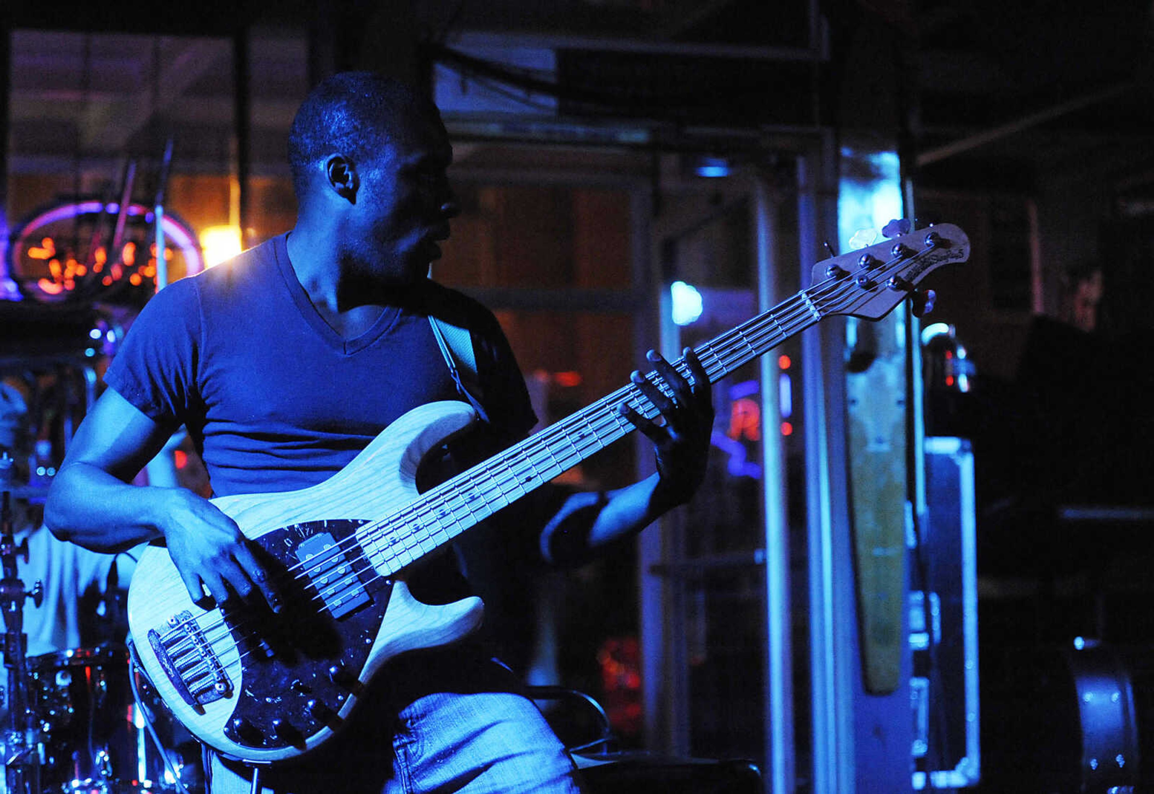 Jamed Hams plays bass during a performance by the Mike Renick Band at the Rude Dog Pub, 123 Main Street, Friday, June 22.