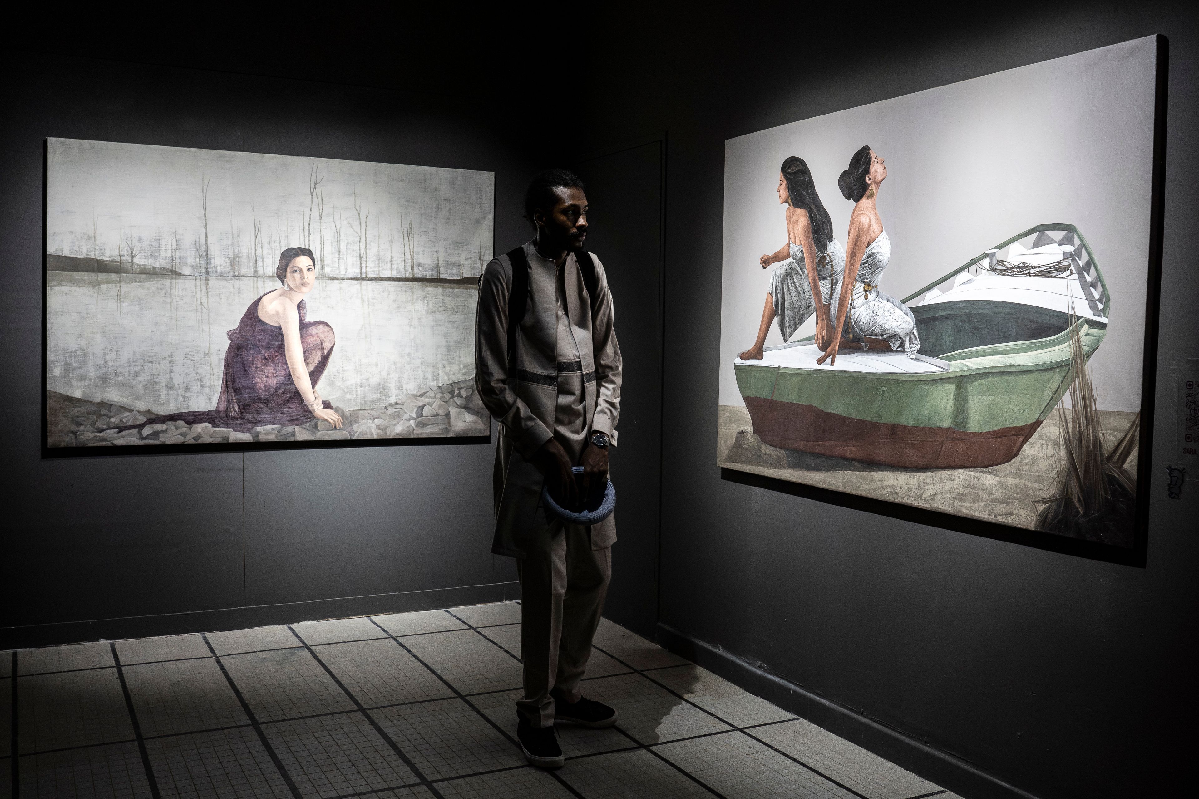 A visitor explores the international exhibit at the Dakar Biennale of Contemporary African Art in Dakar, Senegal, Friday, Nov. 8, 2024. (AP Photo/Annika Hammerschlag)