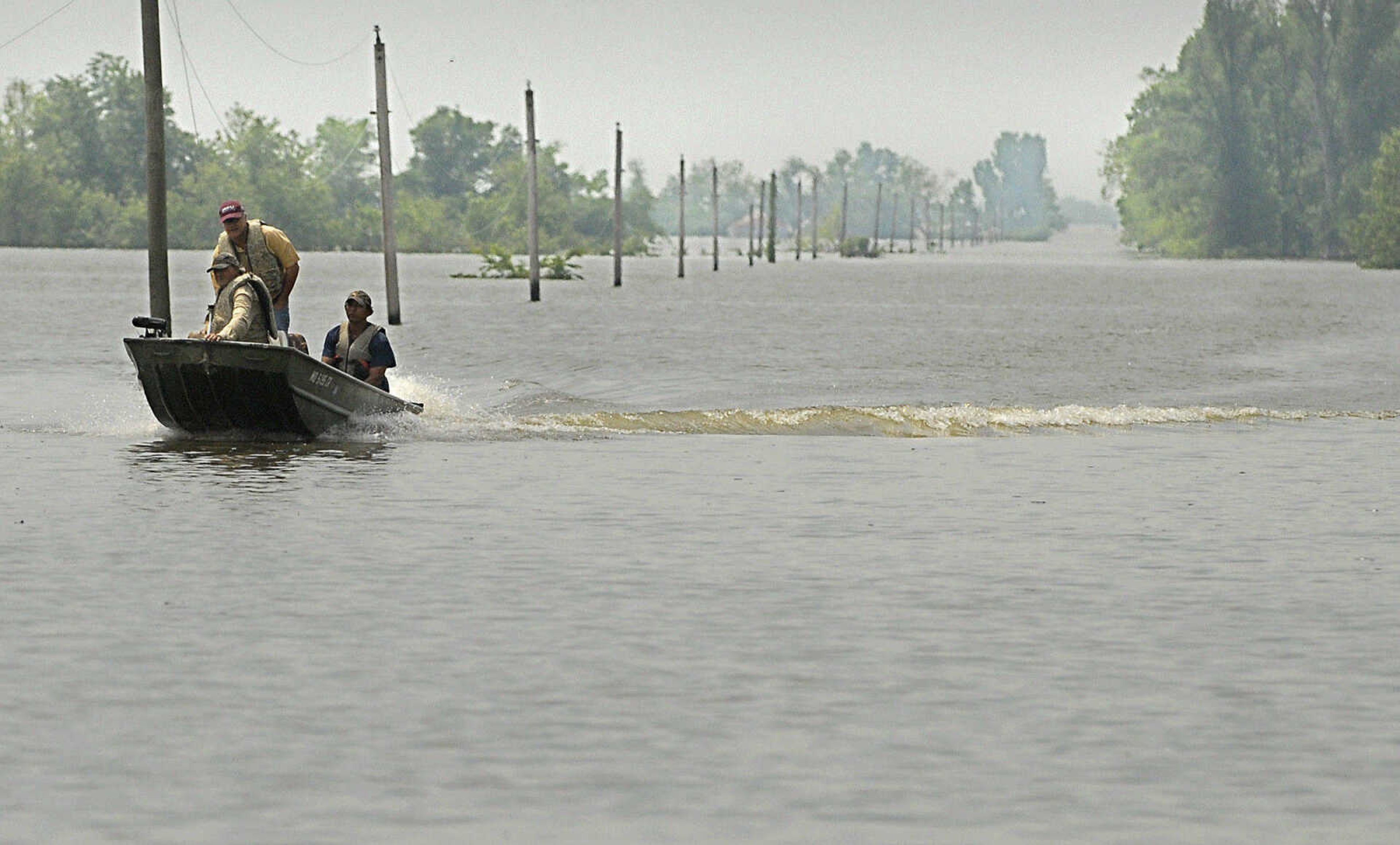 Land owners return to Highway 102 Monday, May 9, 2011 after checking on their property in the floodway in Mississippi County. (Laura Simon)