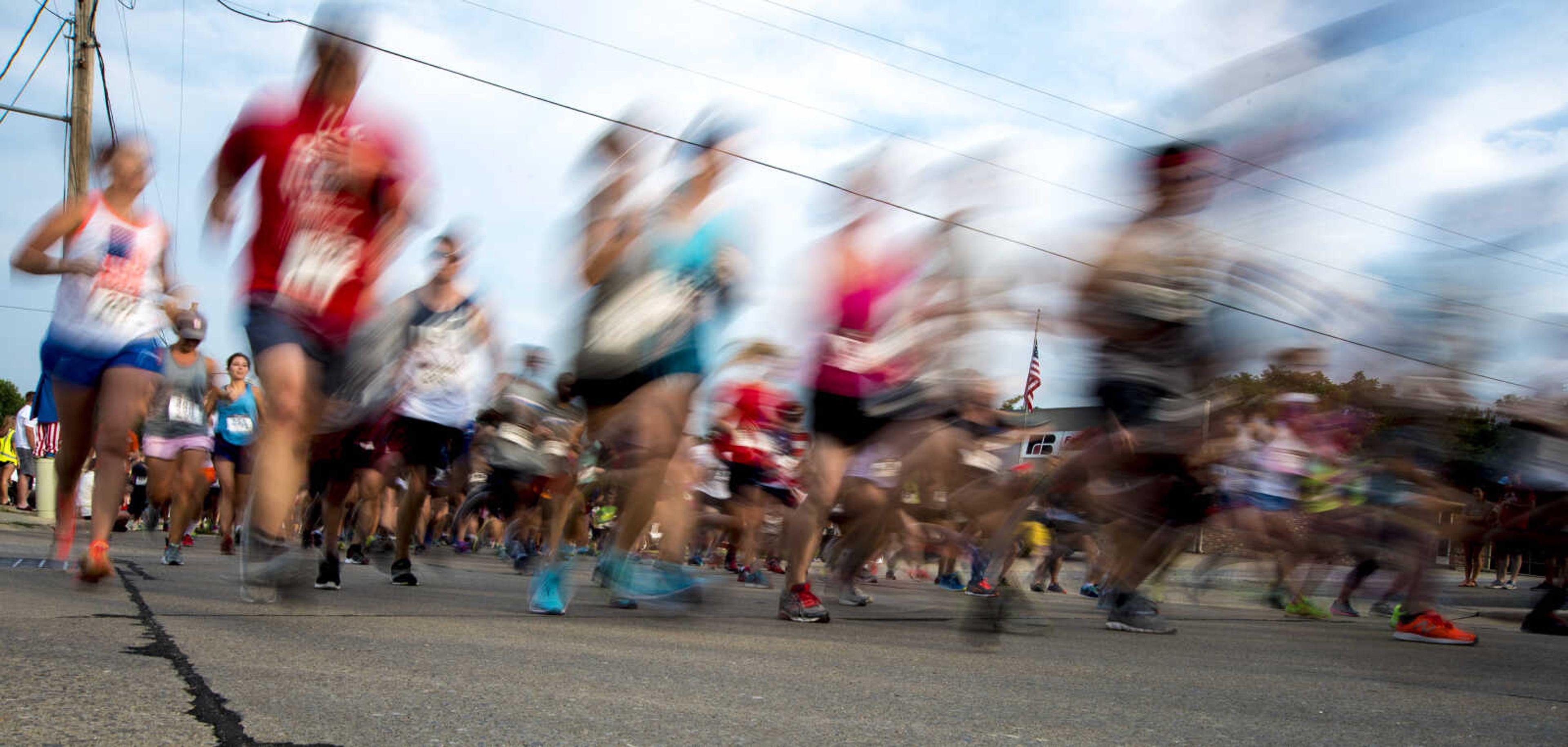 Runners take off during the Independence Day 5k for Jackson Parks and Recreation's July 4th celebration Tuesday, July 4, 2017 in Jackson City Park.