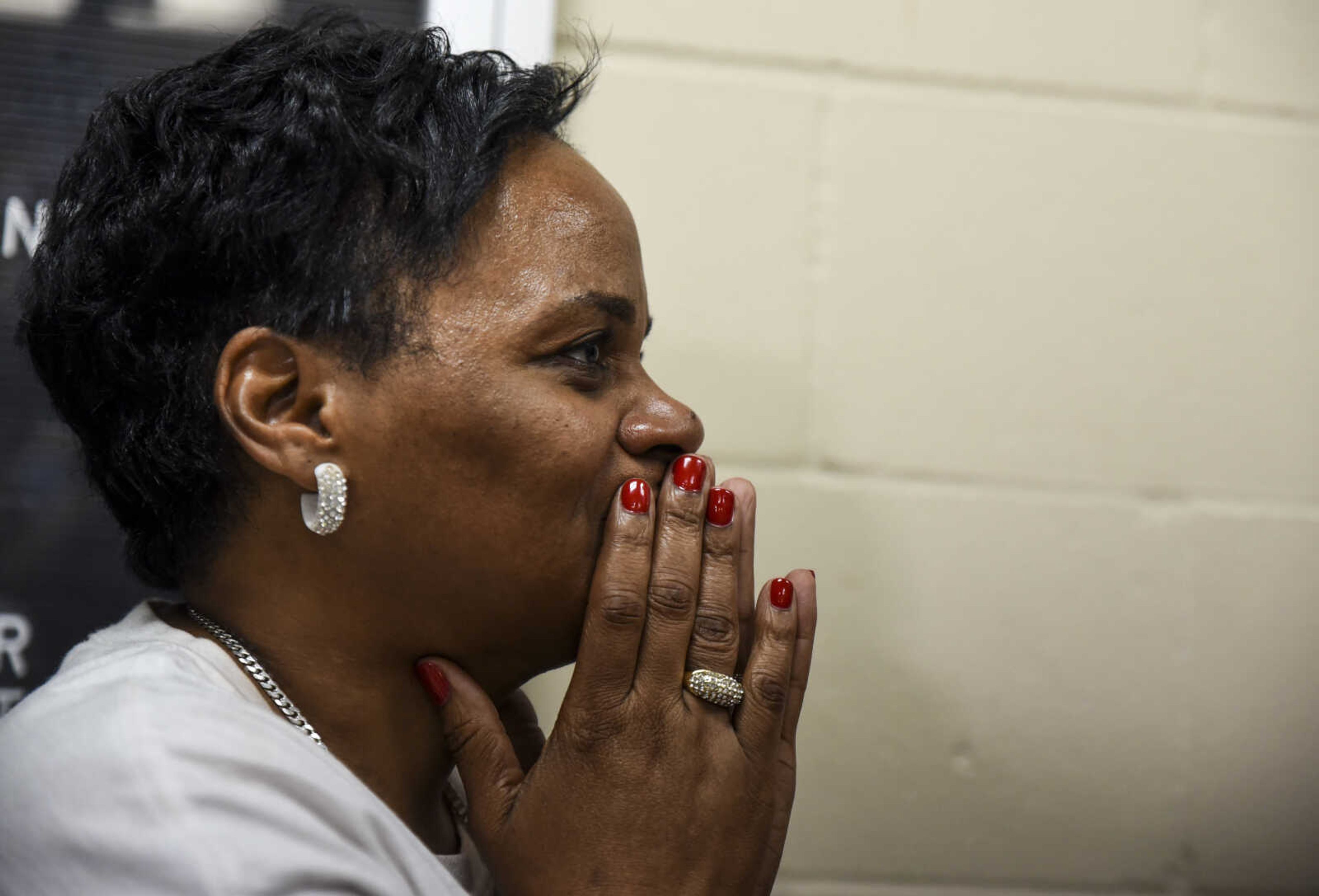 Betty Sharp, full of emotion, watches as David Robinson is reunited with his mother Jennett McCaster and his wife Pat Jackson after being released from the Jefferson City Correctional Center Monday, May 14, 2018 in Jefferson City.