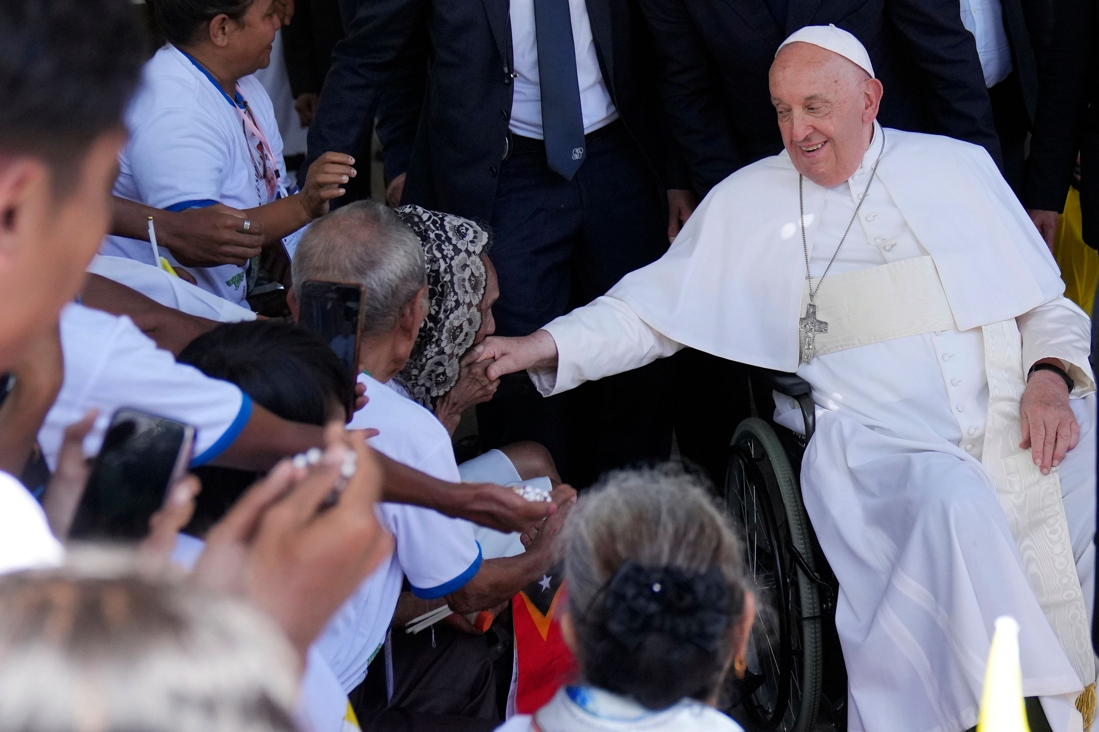 Pope Francis greets the people after the holy mass at the Cathedral of the Immaculate Conception in Dili, East Timor, Tuesday, Sept. 10, 2024. (AP Photo/Dita Alangkara)