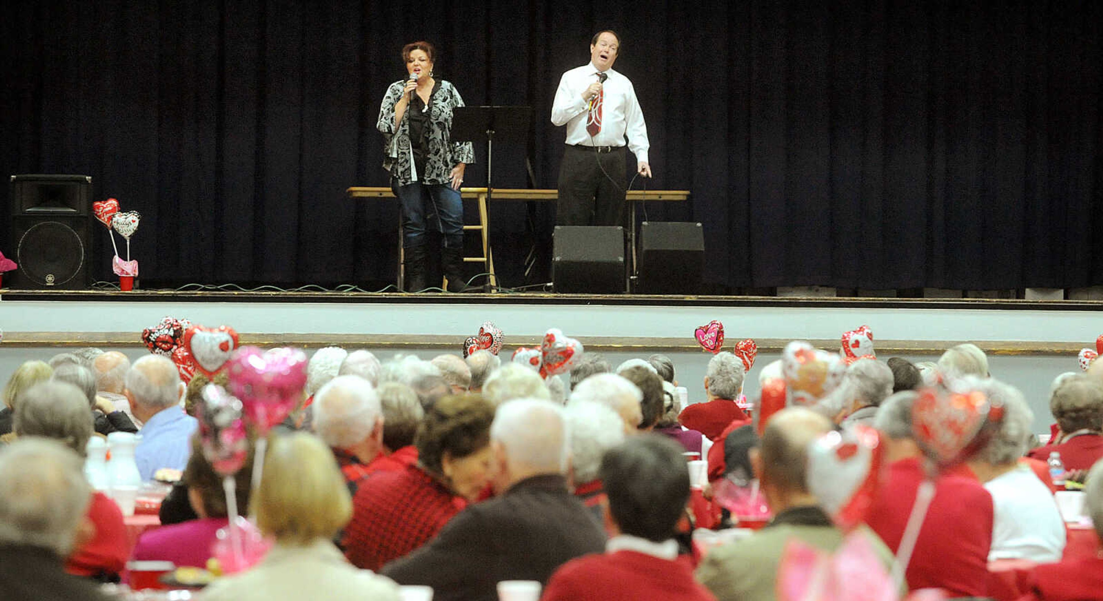 LAURA SIMON ~ lsimon@semissourian.com

Robyn Hosp and Mike Dumey sing for couples married 50 years or more, Friday, Feb. 14, 2014, during the annual Seniors' Valentine's Party at the Arena Building.