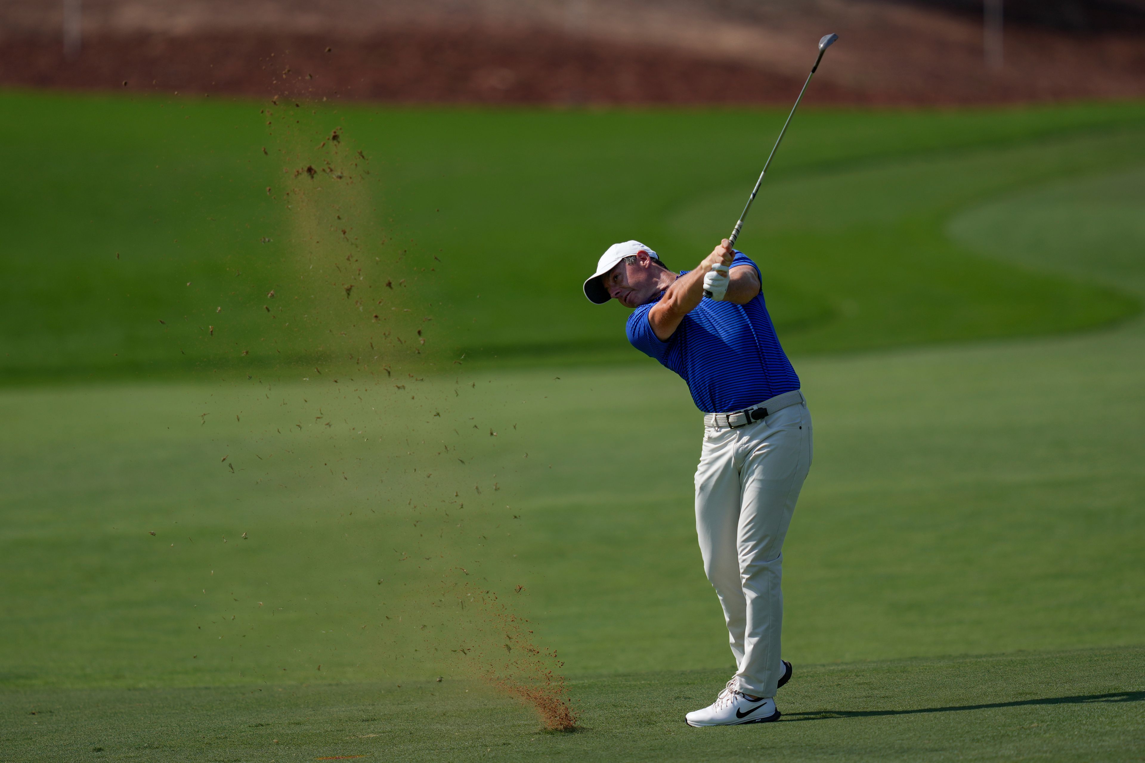 Rory McIlroy of Northern Ireland plays his second shot on the 9th hole in the final round of World Tour Golf Championship in Dubai, United Arab Emirates, Sunday, Nov. 17, 2024. (AP Photo/Altaf Qadri)