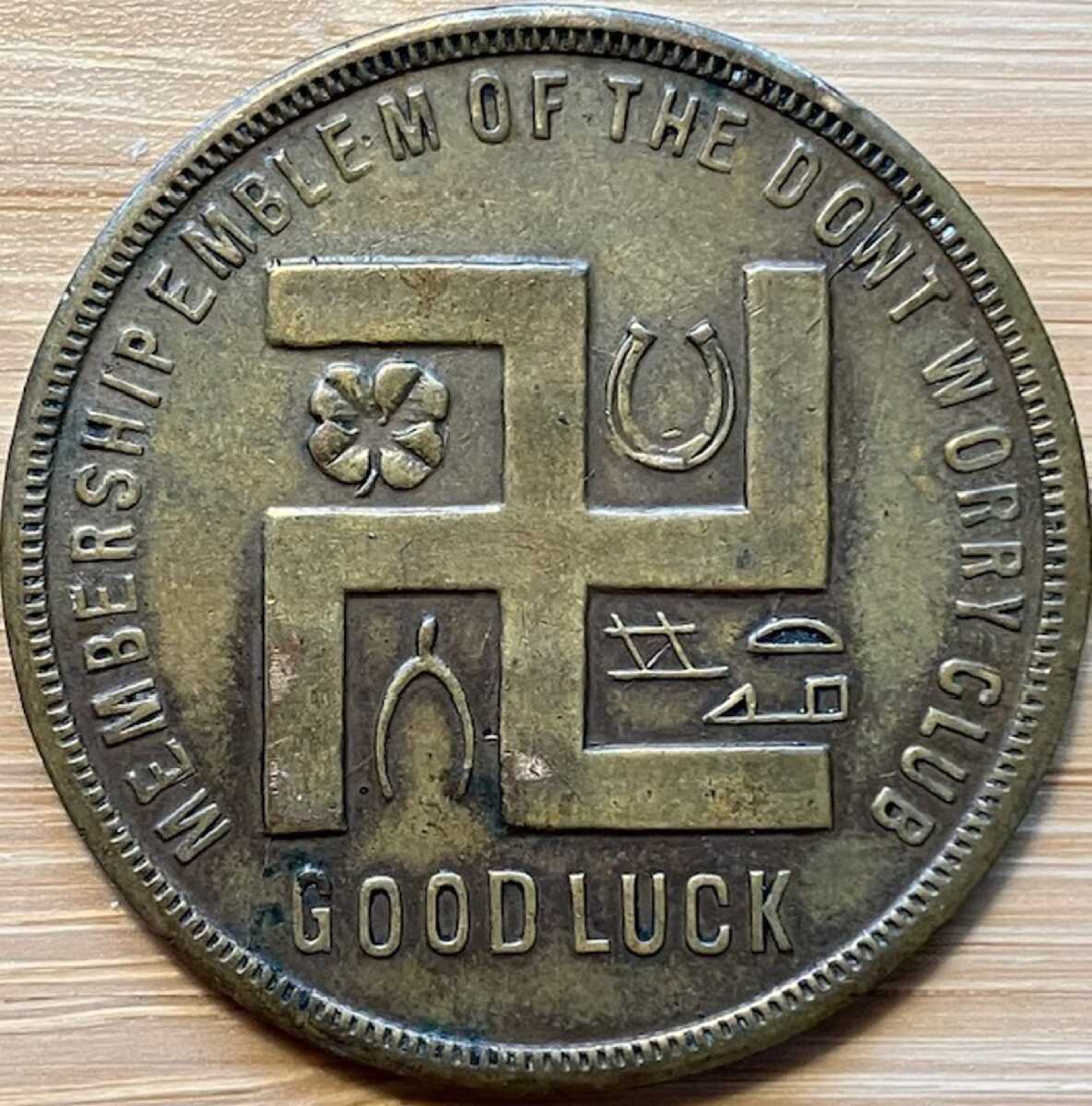 The swastika is seen on a coupon-type store token made before the Nazi Party adopted the symbol. This is part of Holocaust researcher Jeff Kelman's collection, which he says shows the "regular and innocuous use of the swastika as a symbol of good fortune in the West, prior to the Nazi use of the similar-looking hakenkreuz."