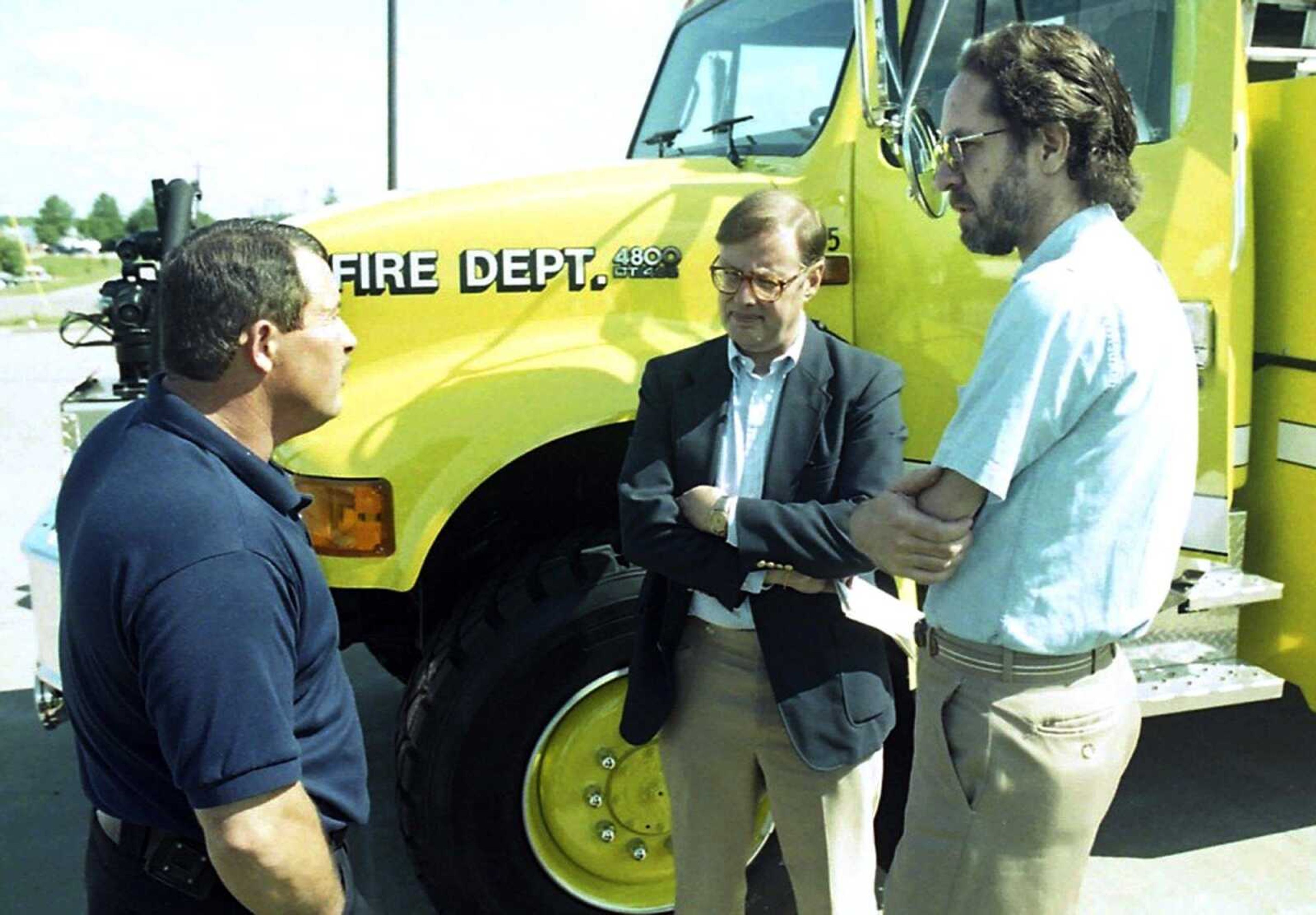 Cape Girardeau Fire Department Capt. Bob Kembel, left, tells city manager Michael Miller, center, and Councilman Tom Neumeyer about the city's new airport crash truck in 1996.