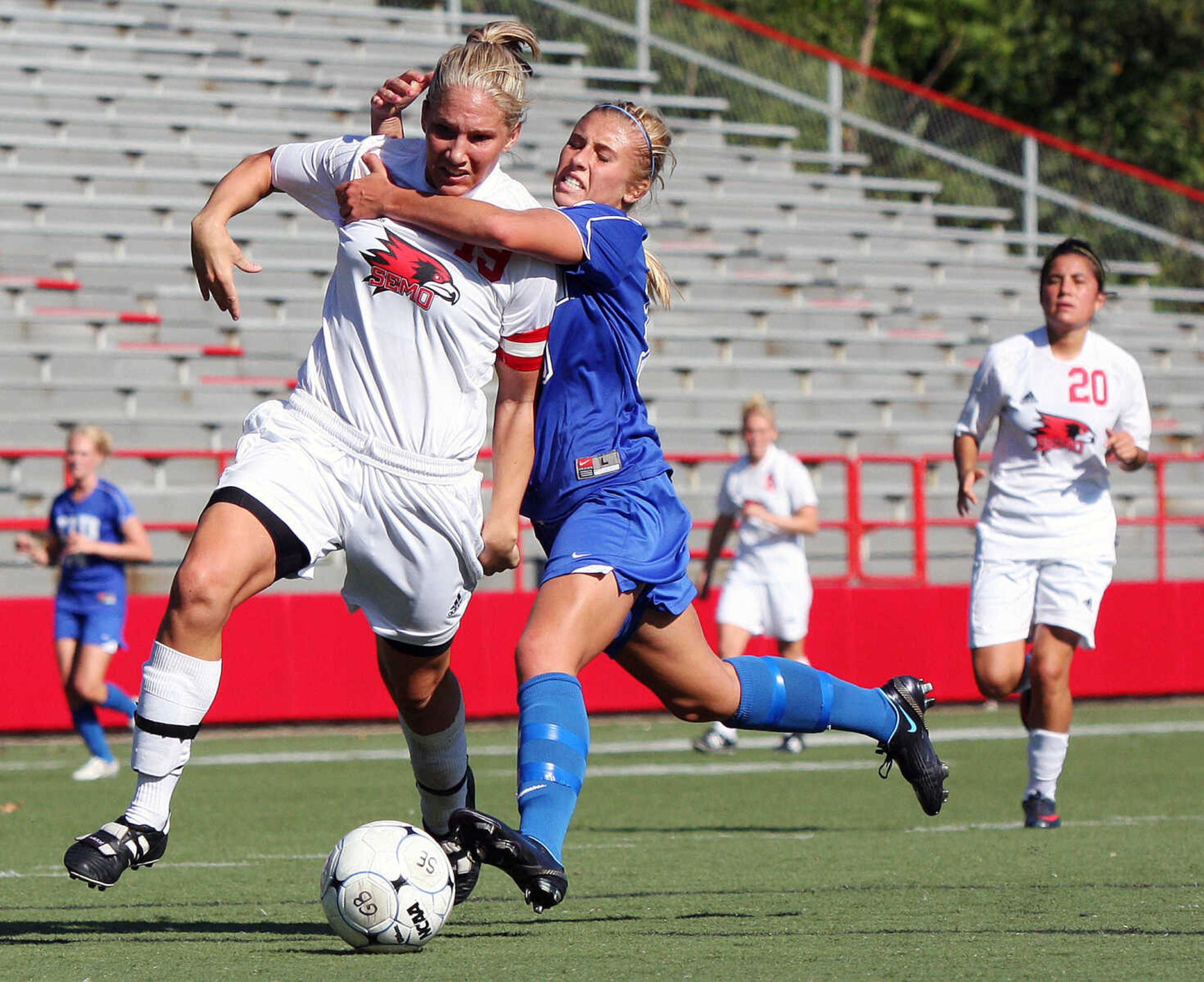 Ashley Runion, left, is pulled off the ball by Erika Prazma inside the Panther's goal box. The foul was called on Ashley.