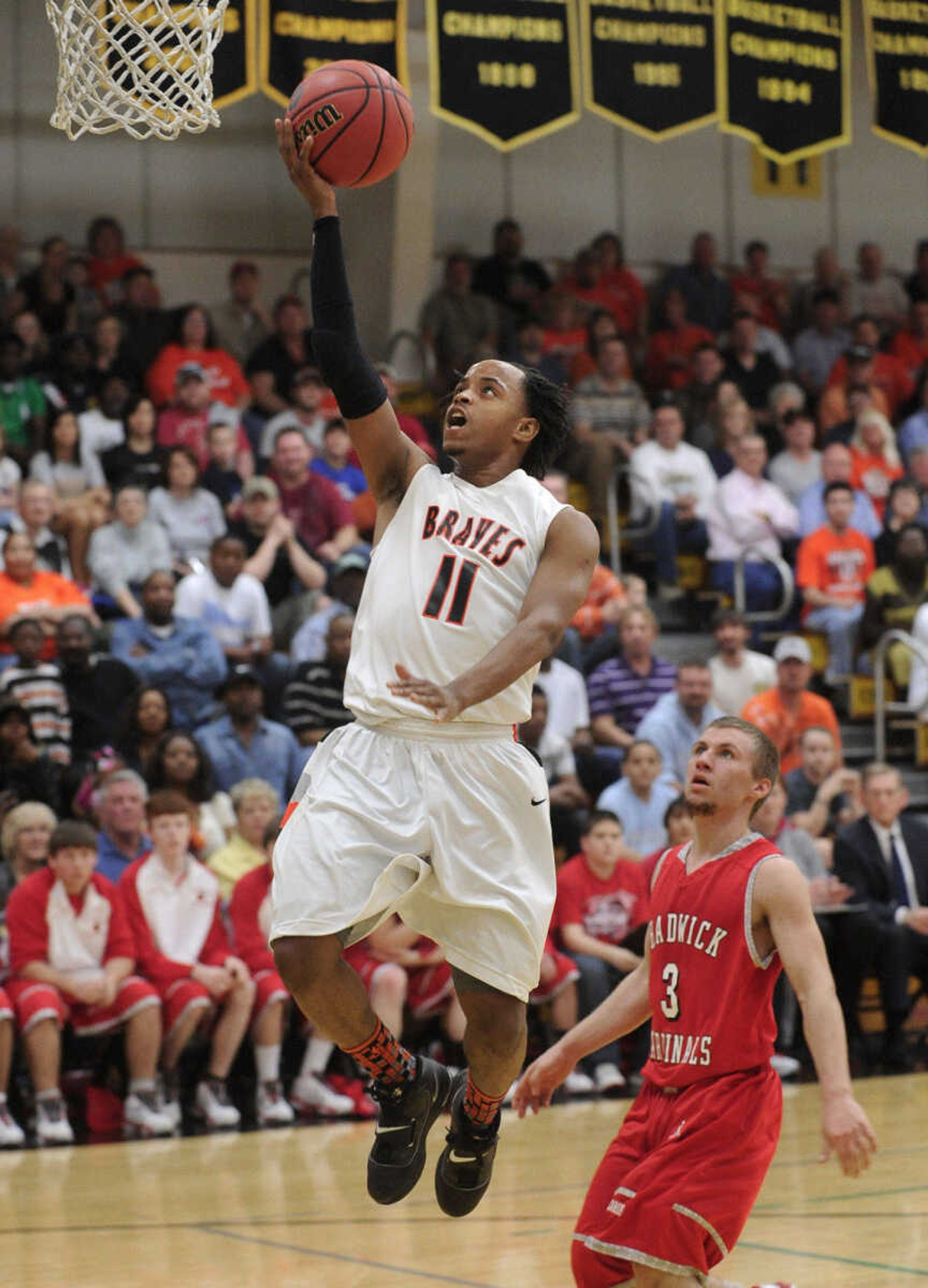 Scott County Central's Stewart Johnson goes up for a shot as Chadwick's Nick Thompson looks on in the second quarter of the Class 1 quarterfinal Saturday, March 12, 2011 in Poplar Bluff, Mo. (Fred Lynch)