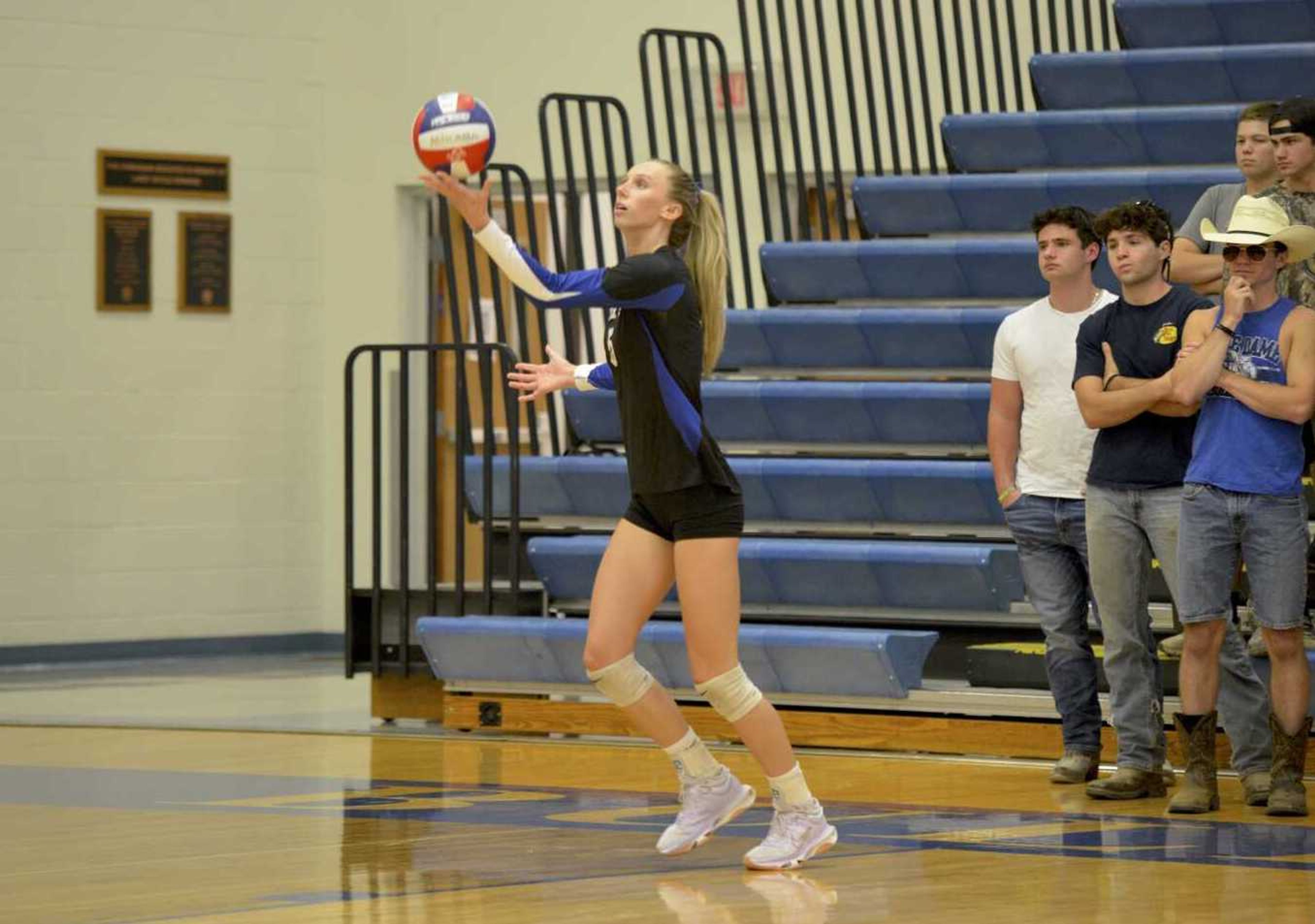 Notre Dame senior Courtney Tatum serves the ball against Scott City on Wednesday, Sept. 11, at Notre Dame High School.