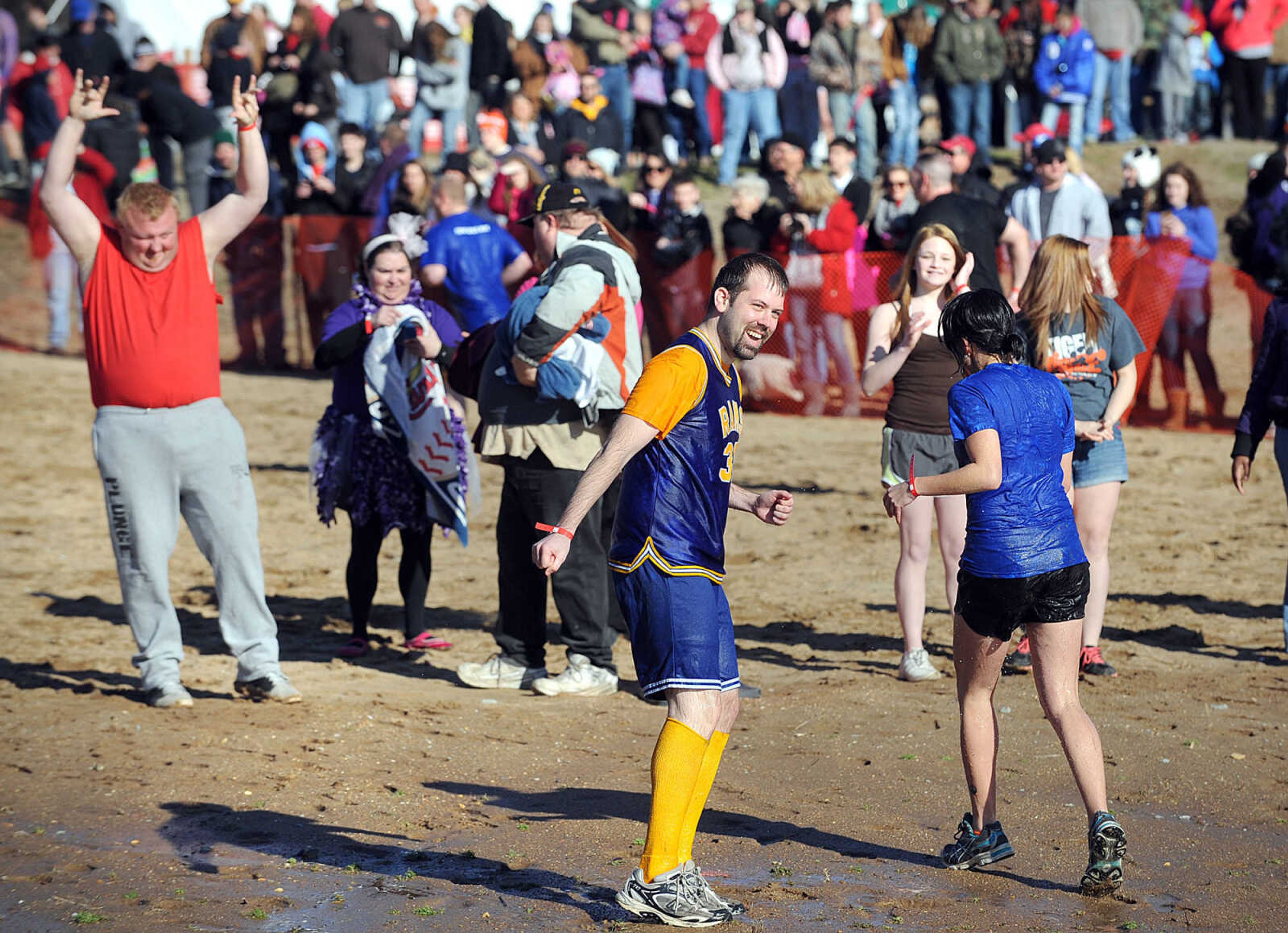 LAURA SIMON ~ lsimon@semissourian.com
People plunge into the cold waters of Lake Boutin Saturday afternoon, Feb. 2, 2013 during the Polar Plunge at Trail of Tears State Park. Thirty-six teams totaling 291 people took the annual plunge that benefits Special Olympics Missouri.