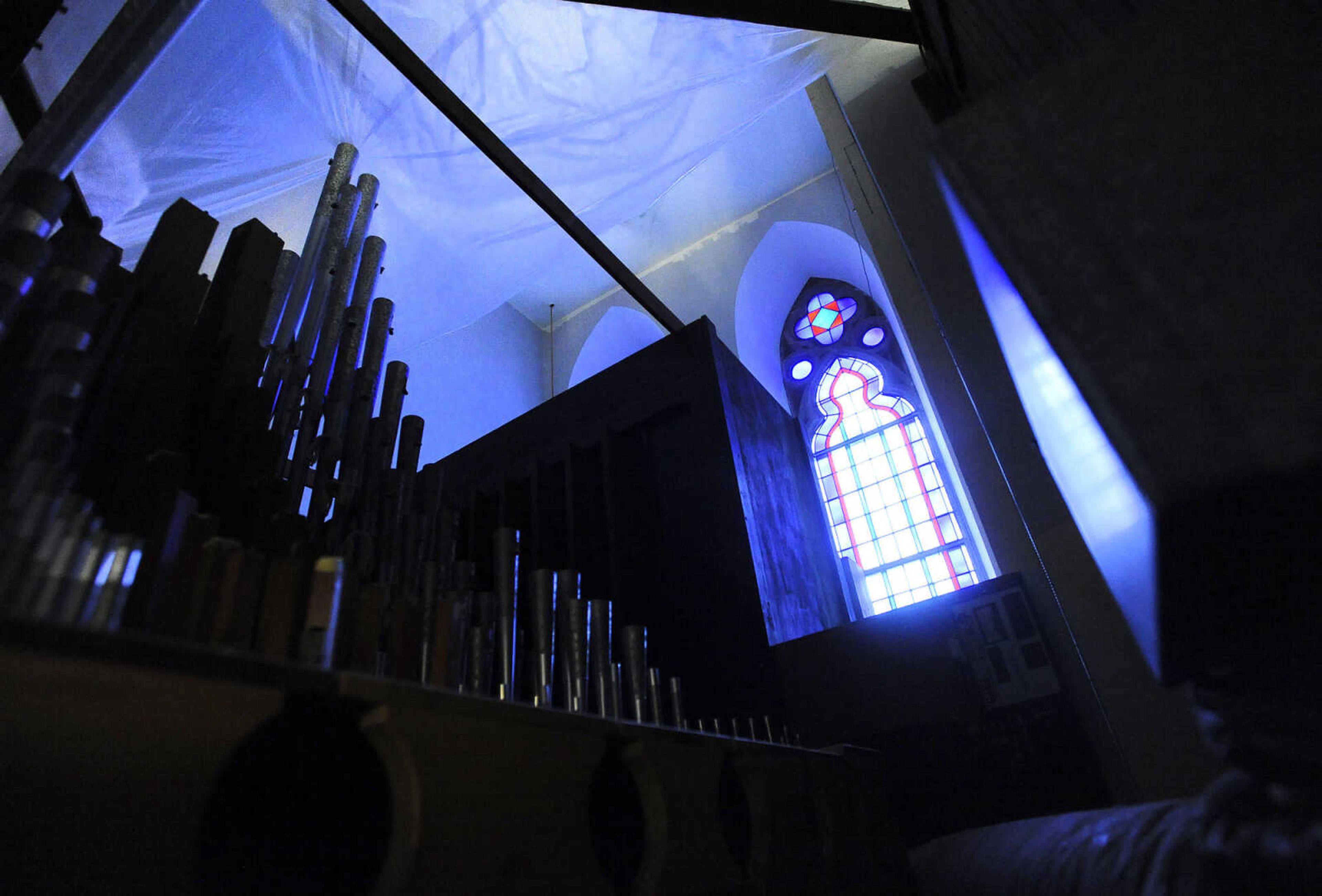 LAURA SIMON ~ lsimon@semissourian.com

The pipes from the organ glow from the stained glass window at St. John's Catholic Church in Leopold, Missouri on March 3, 2016.