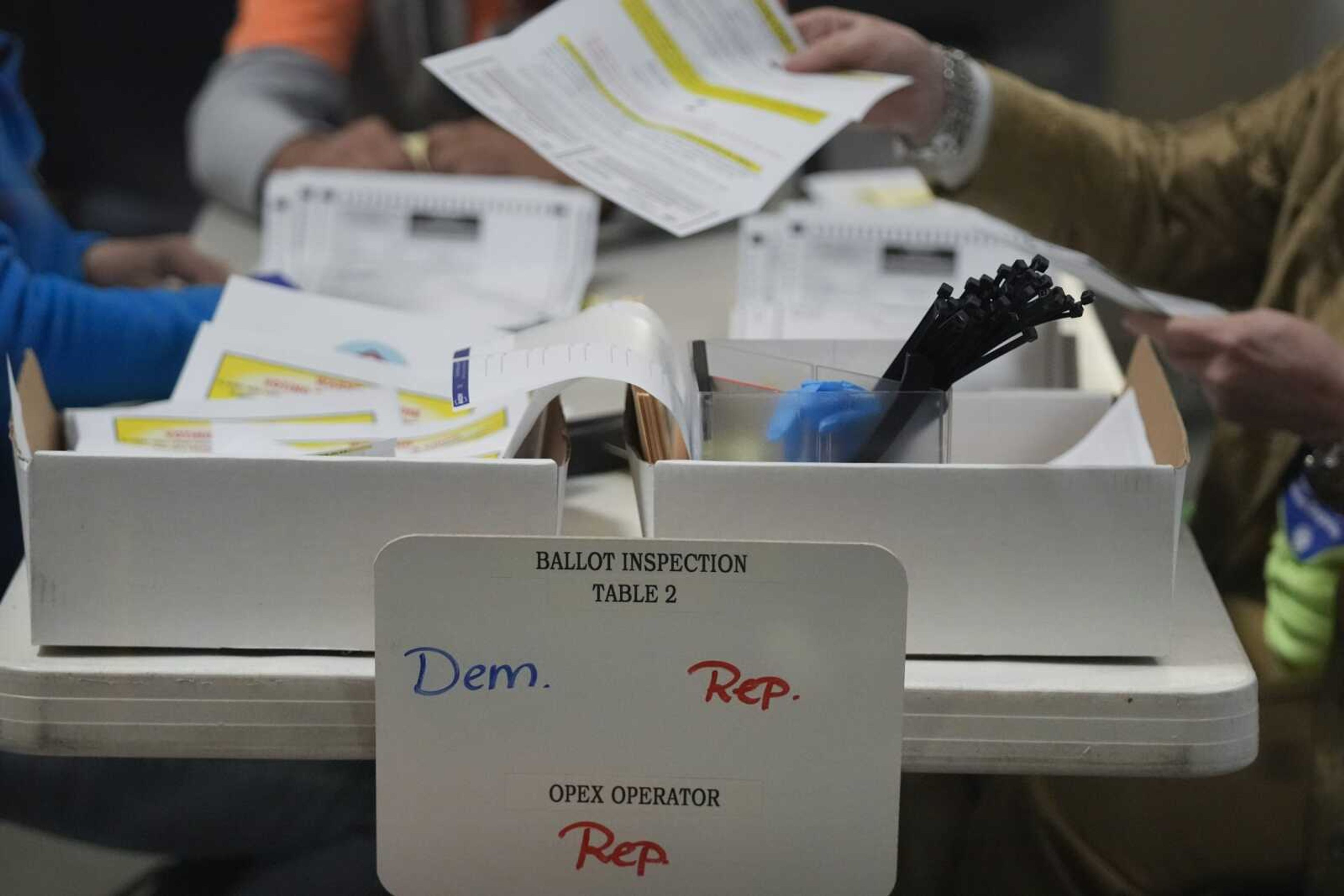 Election workers process ballots at the Clark County Election Department on Nov. 10 in Las Vegas. Vote counting even in races where a winner can be called on election night doesn't stop until every eligible ballot has been verified and counted, and that takes time -- sometimes a few days or even a week or more.