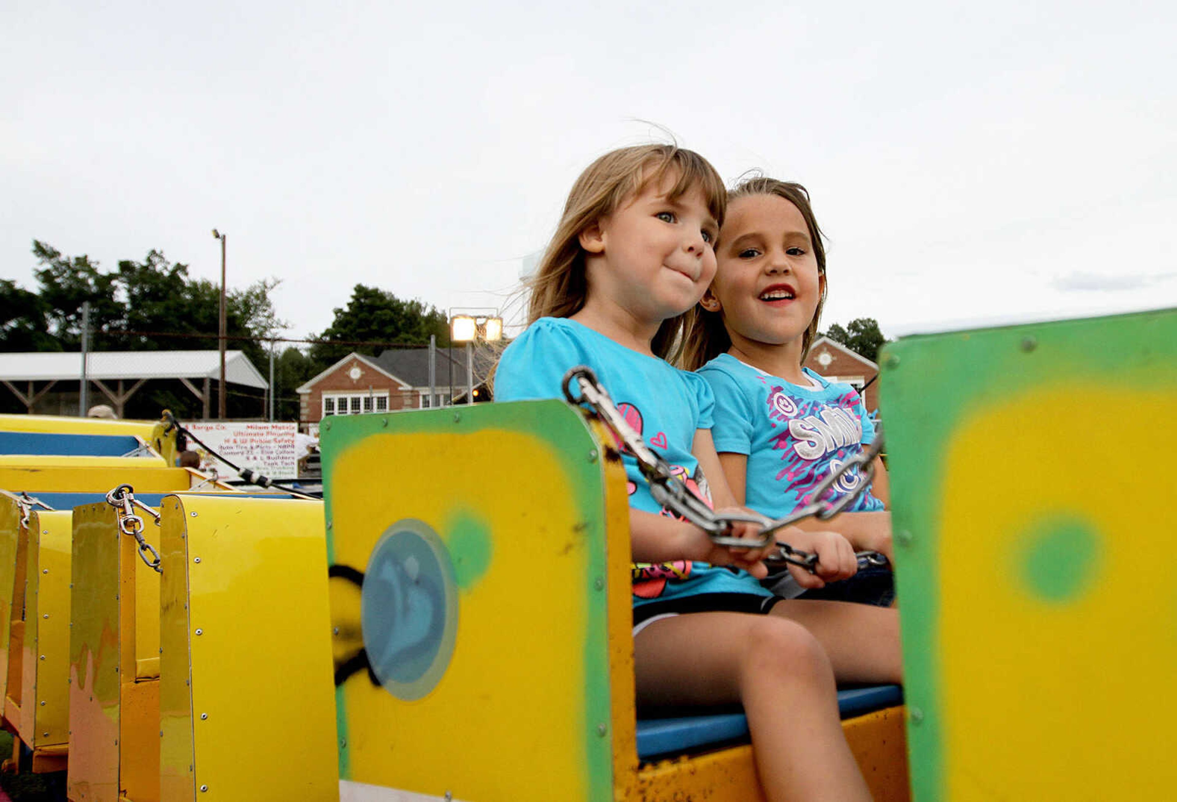 GLENN LANDBERG ~ glandberg@semissourian.com

Cousins, Elaina Bricker and Peyton Morris ride a roller coaster Saturday, Aug. 30, 2014 at Neighbor Days in Benton, Missouri.