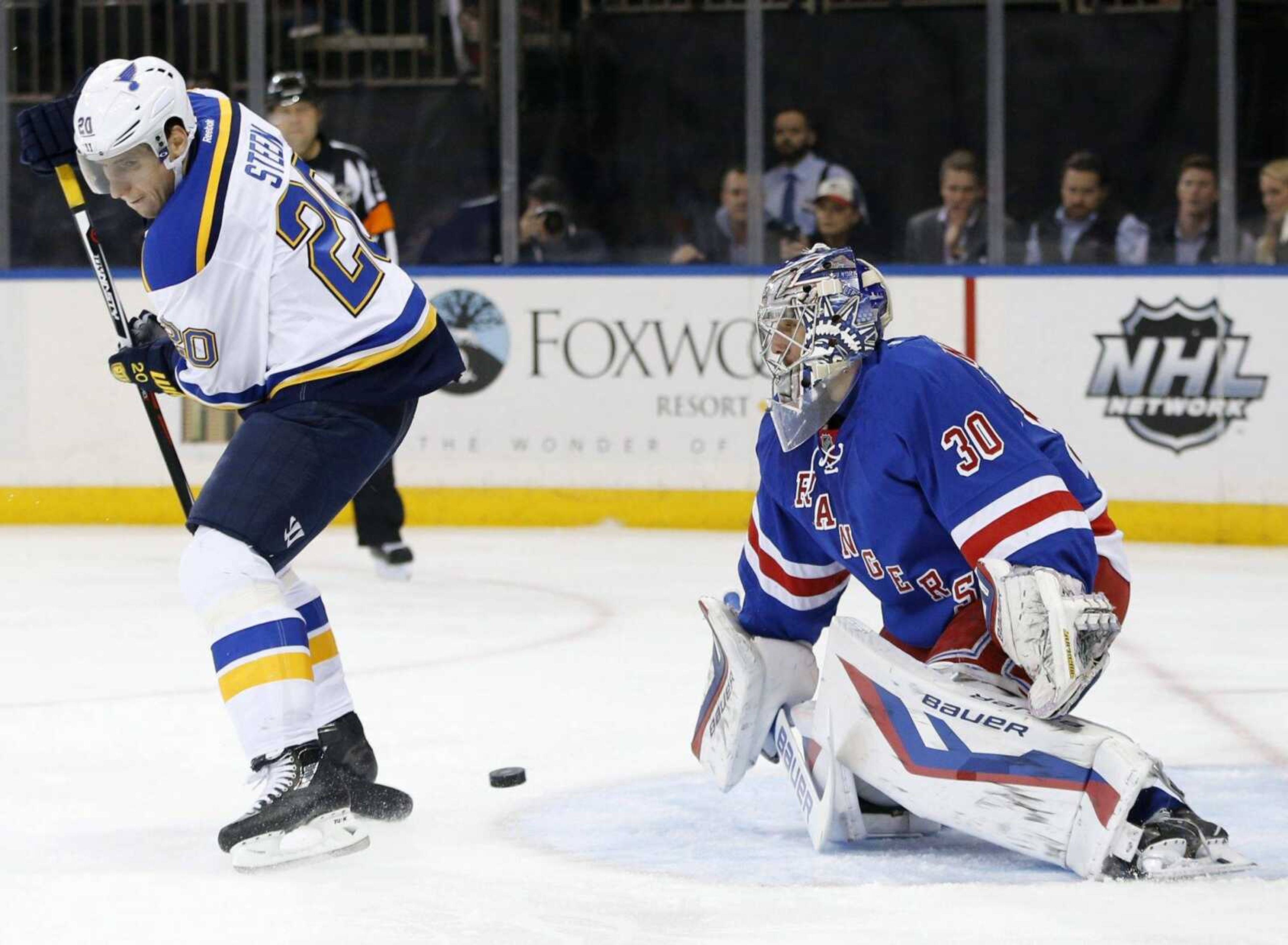 Blues left wing Alexander Steen shoots through his legs toward Rangers goalie Henrik Lundqvist during the first period Thursday in New York. (Kathy Willens ~ Associated Press)