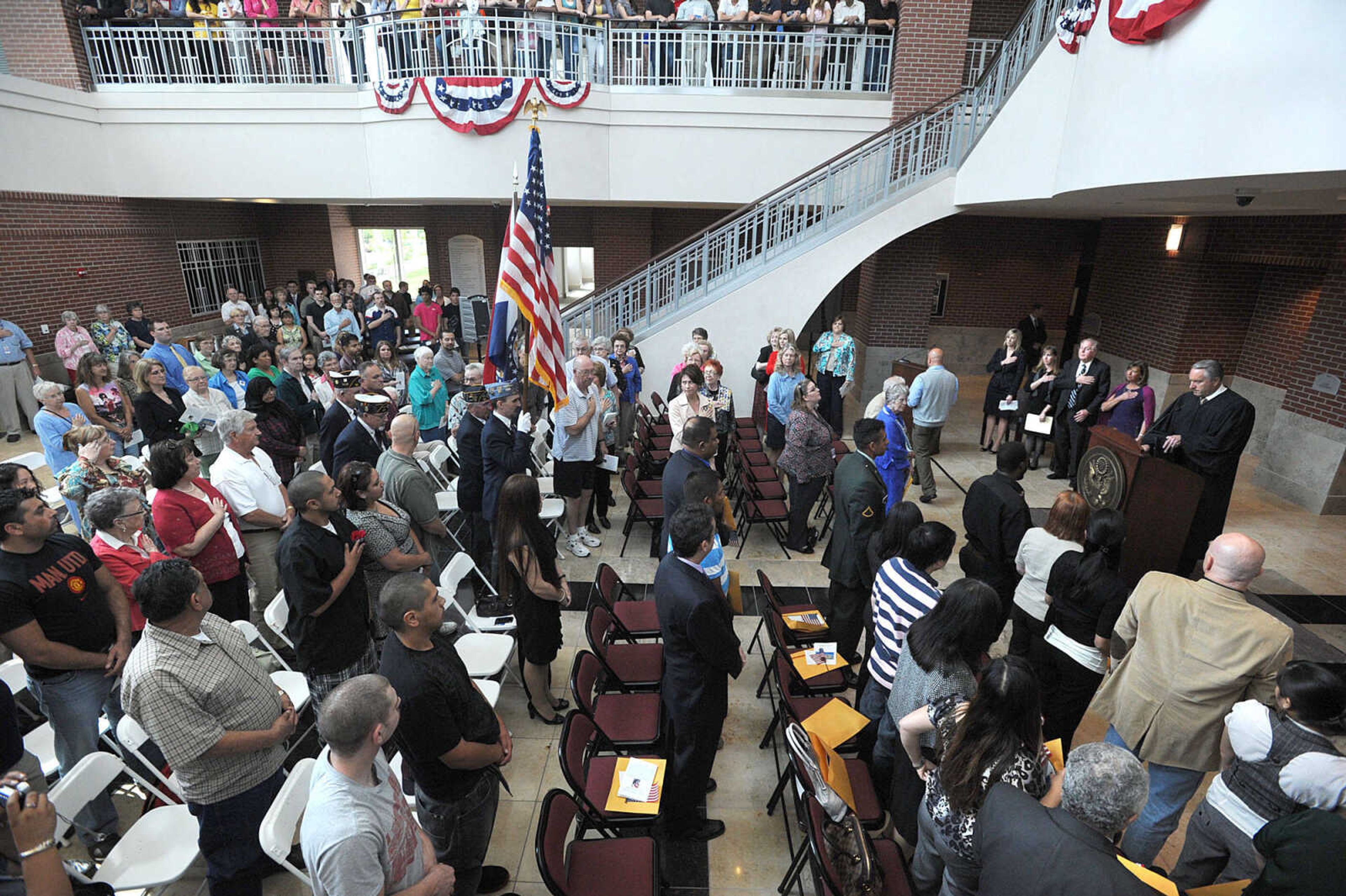 LAURA SIMON ~ lsimon@semissourian.com
The Lewis K. Juden Post No. 63 of the American Legion head through the crowd during the posting of the colors Tuesday, May 1, 2012 at the Rush Hudson Limbaugh, Sr. U.S. Courthouse in Cape Girardeau. Seventeen petitioners became citizens of the United States of America during Tuesday's naturalization ceremony.