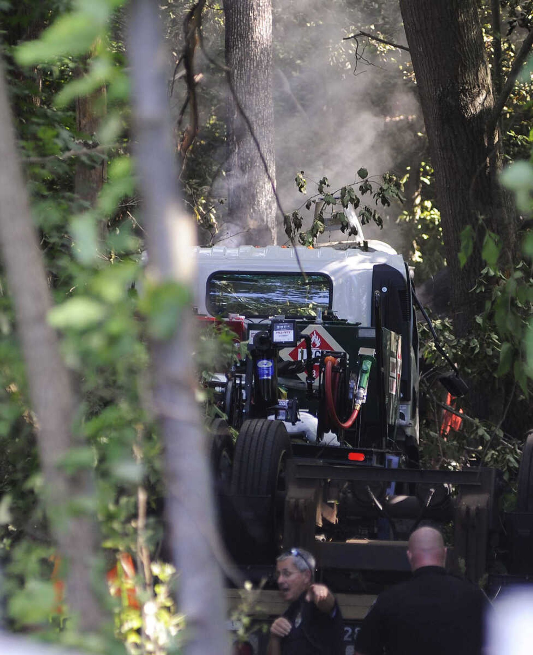 Smoke rises from the tractor-trailer involved in a single-vehicle accident on southbound Interstate 55. (Adam Vogler)