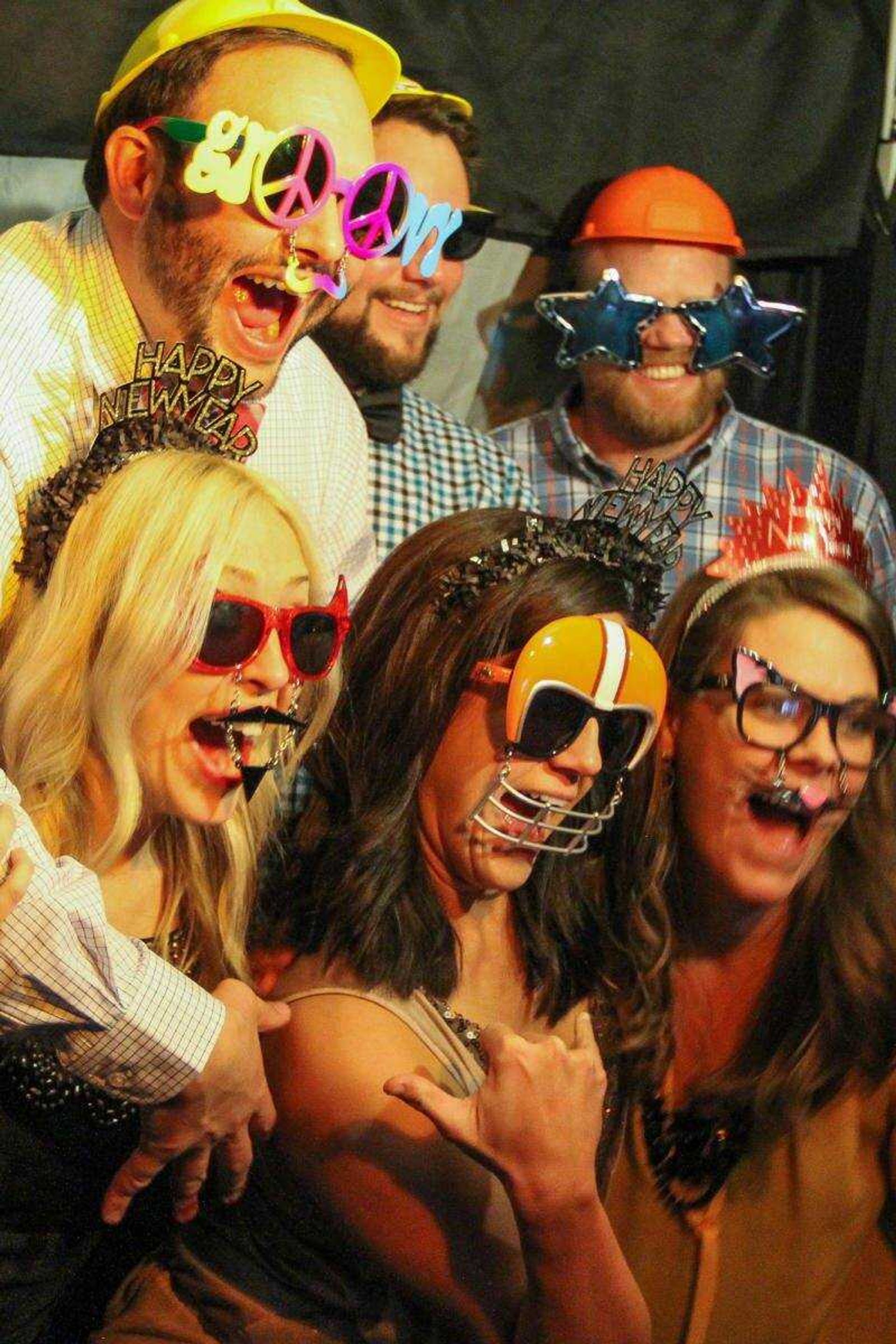 Attendees take a photo in the photo booth during the fifth annual St. Jude's New Year's Eve Benefit on Dec. 31, 2014, at Rays Plaza Banquet Center in Cape Girardeau.