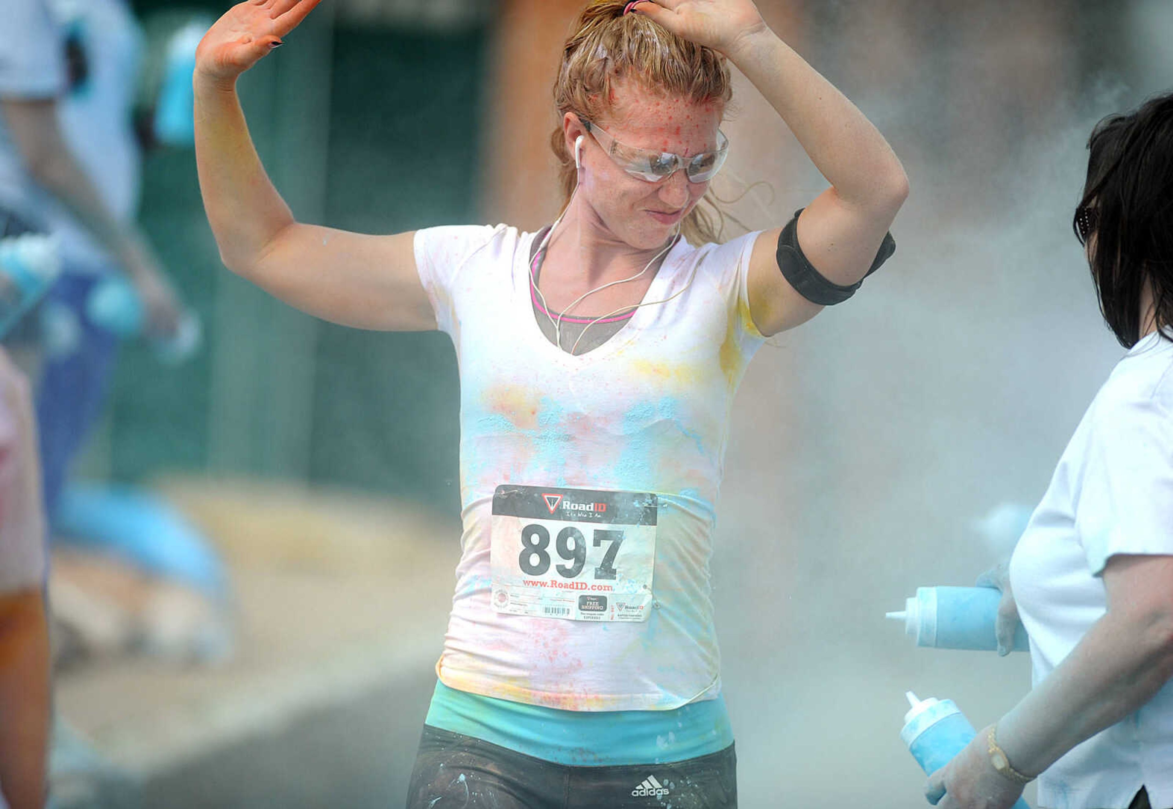 LAURA SIMON ~ lsimon@semissourian.com

Participants in the Color Me Cape 5K are sprayed with blue powder at the final color station on Main Street, Saturday, April 12, 2014, in Cape Girardeau.