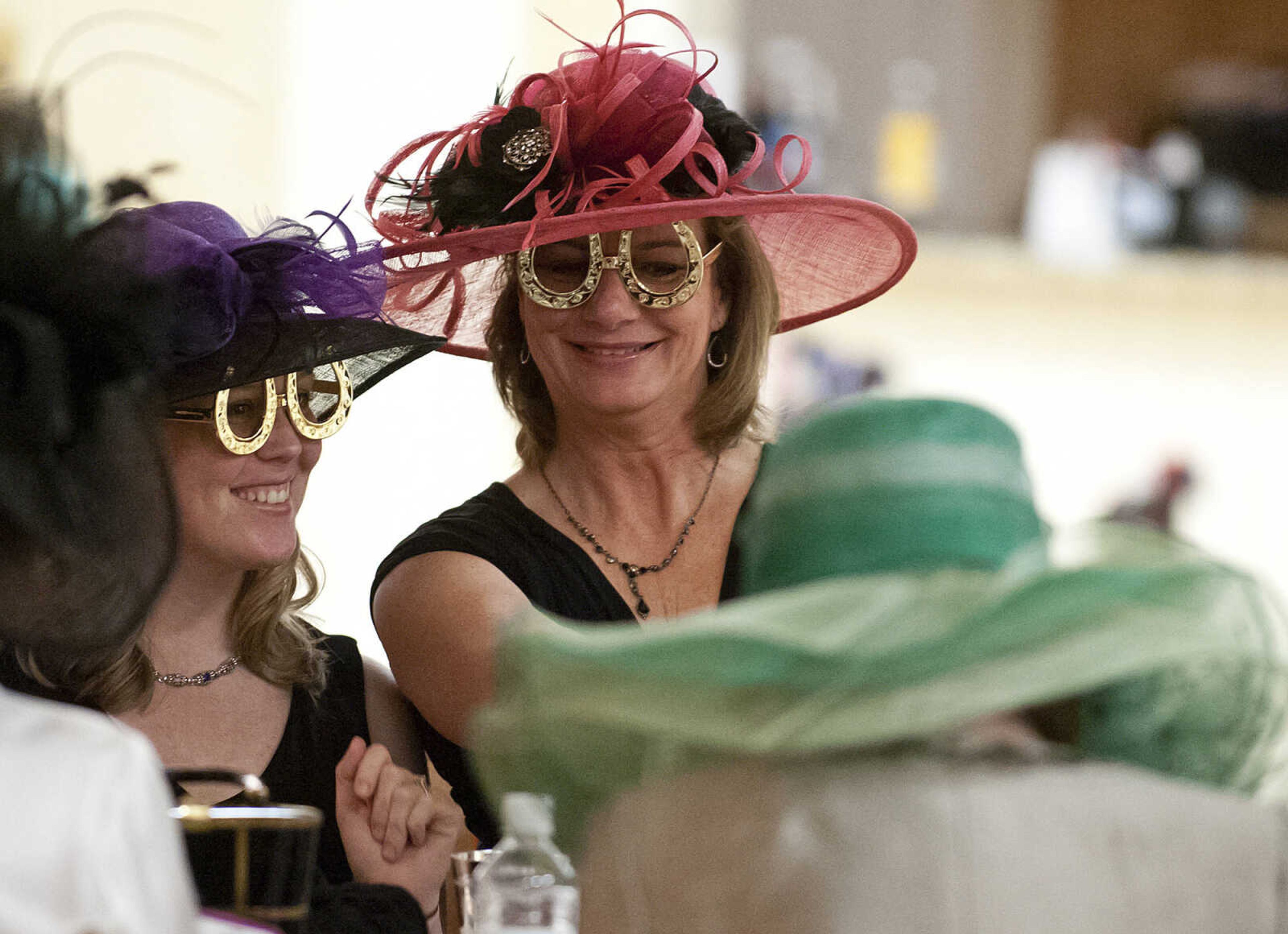 Leni, left, and Kathy Lambdin take a picture of themselves at the Lutheran Family and Children's Services Foundation's "Boas & Bling, Kentucky Derby Party," Thursday, May 1, at The Venue in Cape Girardeau. More than 450 people attended the annual event  which is a fundraiser for the not-for-profit social services organization which provides counseling, adoption services, child care, youth mentoring services and advocacy on behalf of children and families.