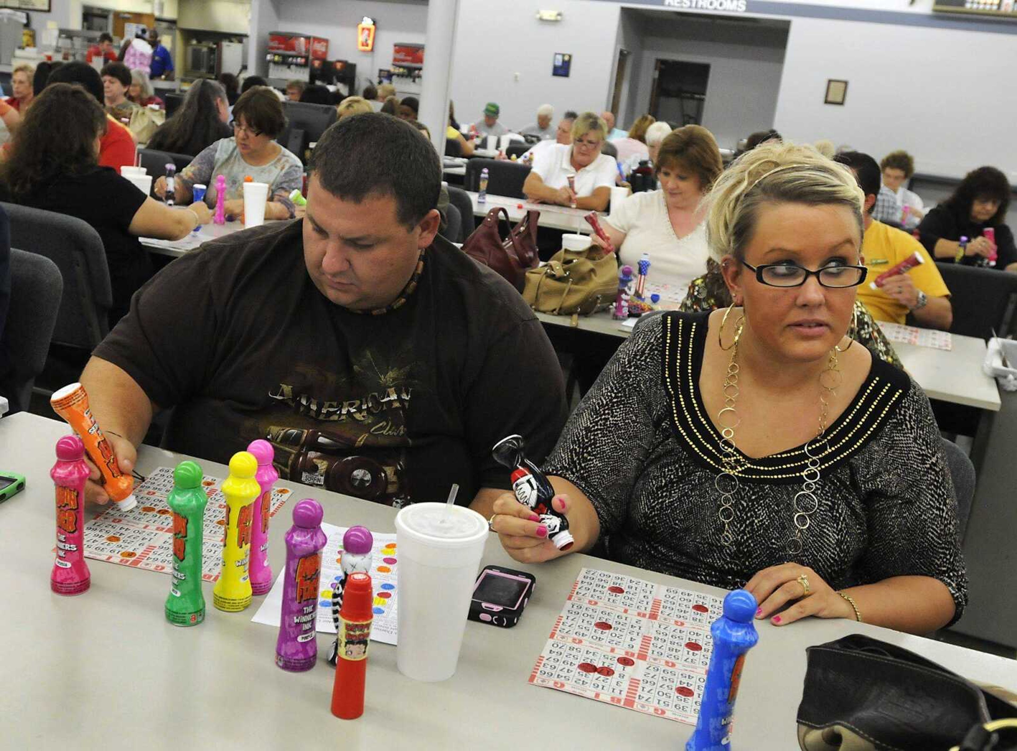 Larry Miller and Heather Small of Jackson play bingo Saturday at Bingo World in Cape Girardeau. (Kristin Eberts)