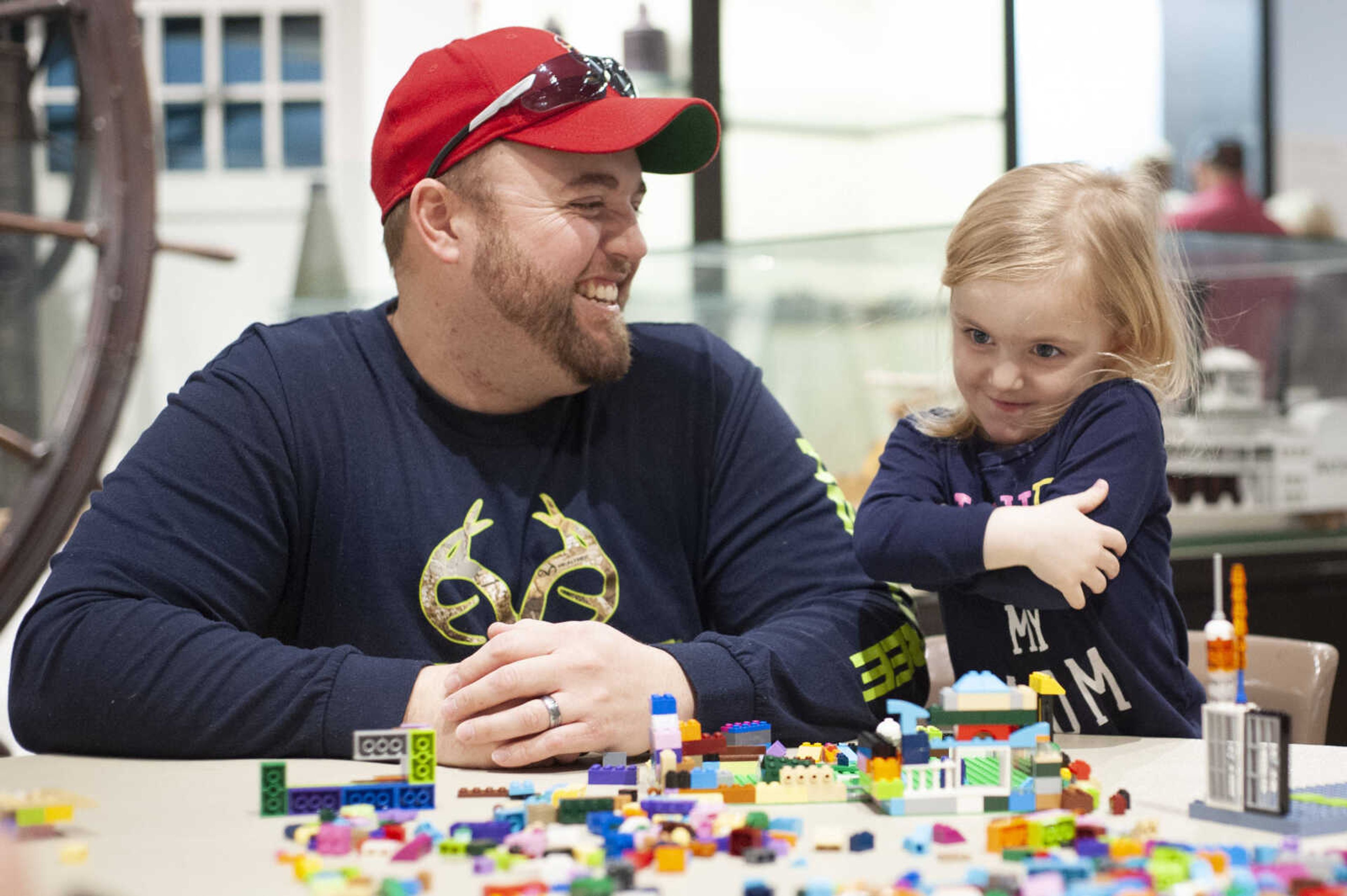 Seth Bollinger shares a moment with his daughter Allie Bollinger, 3, of Jackson while building during a Museum LEGO Day on Saturday, Feb. 8, 2020, at The Rosemary Berkel and Harry L. Crisp II Museum at Southeast Missouri State University's River Campus in Cape Girardeau. Museum manager Jim Phillips said this is the first time for the event has been held and there are plans to hold the event again. "Everybody can relate to a LEGO brick," Phillips said. "We're trying to stay true to our educational mission and show that you can learn through the museum and through toys at the same time."