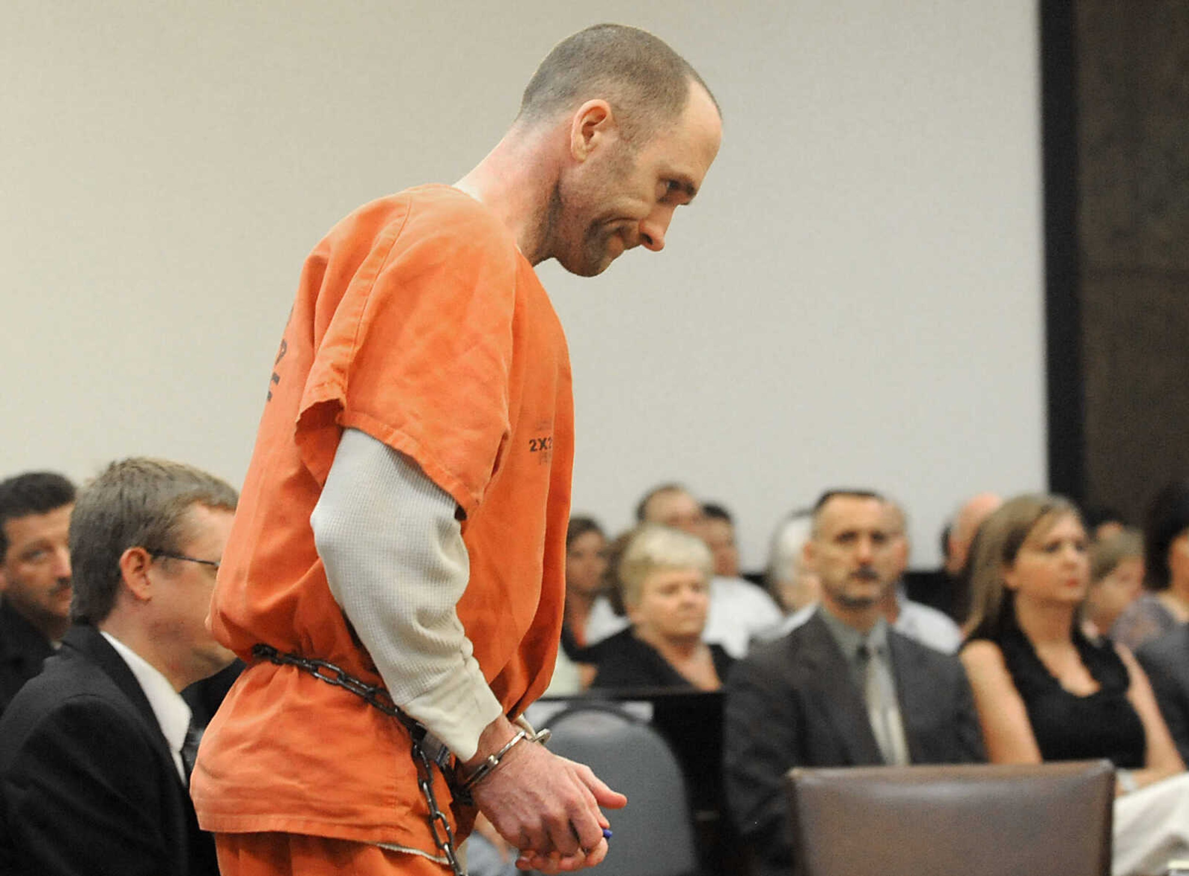 LAURA SIMON ~ lsimon@semissourian.com
Clay Waller walks to the podium to face Cape Girardeau County Circuit Judge Ben Lewis Thursday, June 6, 2013, to pleading guilty to second-degree murder for the death of his wife, Jacque Waller. Jacque Waller went missing June 1, 2011. Her body was found last Wednesday in Southern Illinois.