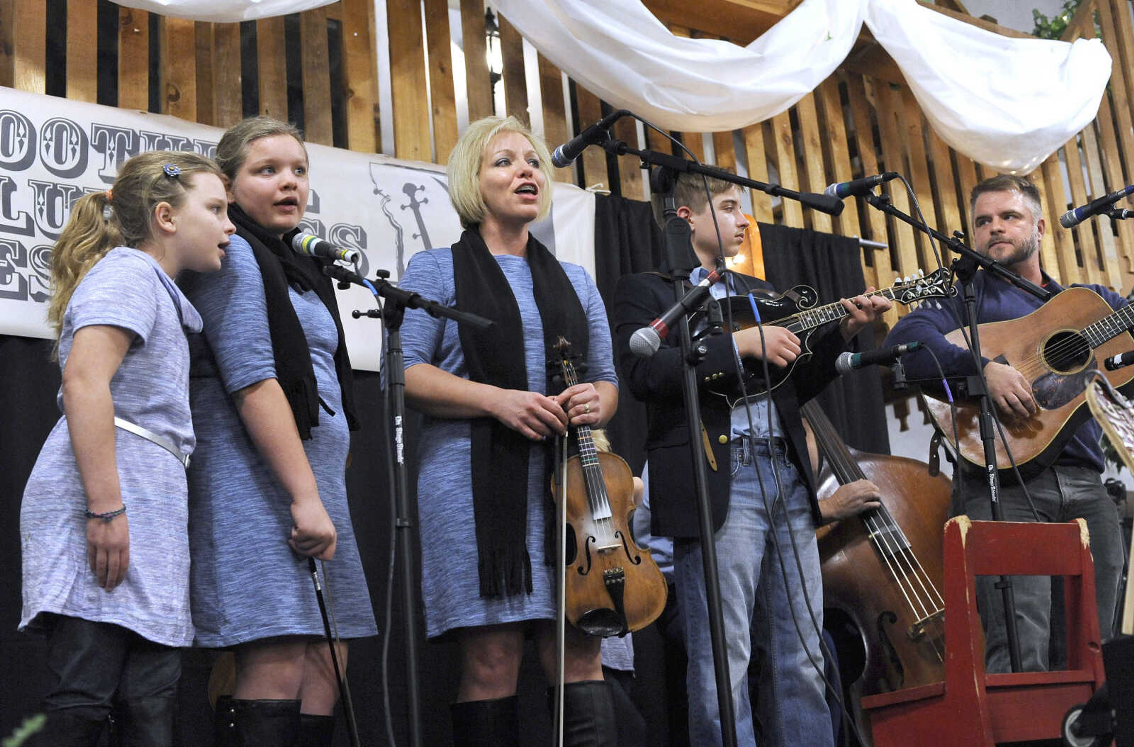 FRED LYNCH ~ flynch@semissourian.com
The Gipsons, from left, Megan, Corley, Tara, Sawyer and Brad, perform a bluegrass gospel song, "Redeemed by the Blood of the Lamb," on opening night of the Bootheel Bluegrass Festival on Thursday, Jan. 26, 2017 at Bavarian Halle in Jackson.