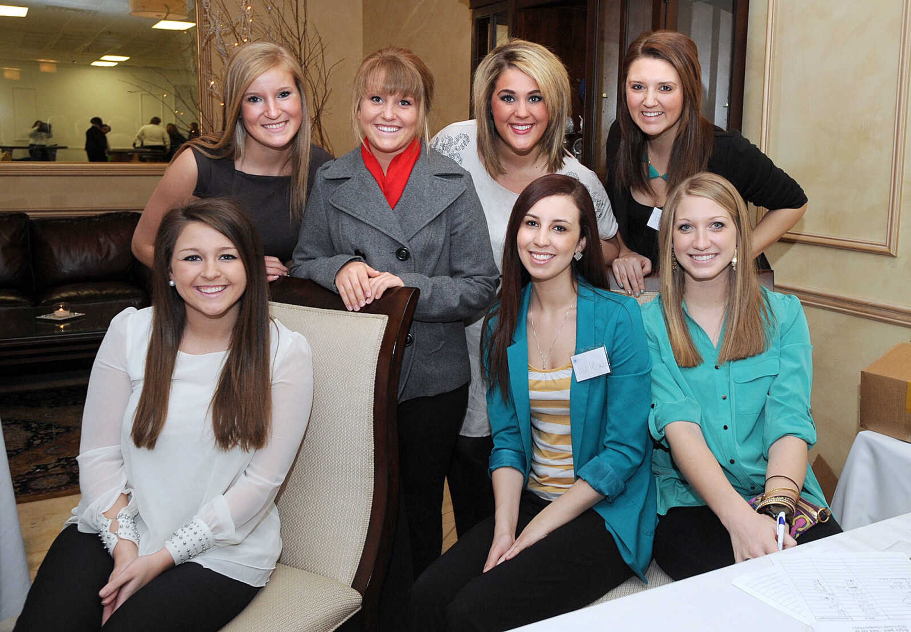 LAURA SIMON ~ lsimon@semissourian.com
Members of Southeast Missouri State University's Alpha Delta Pi sorority pose for a photo Saturday night, Jan. 26, 2013 during the Notre Dame Regional High School Winter Extravaganza at The Venue.