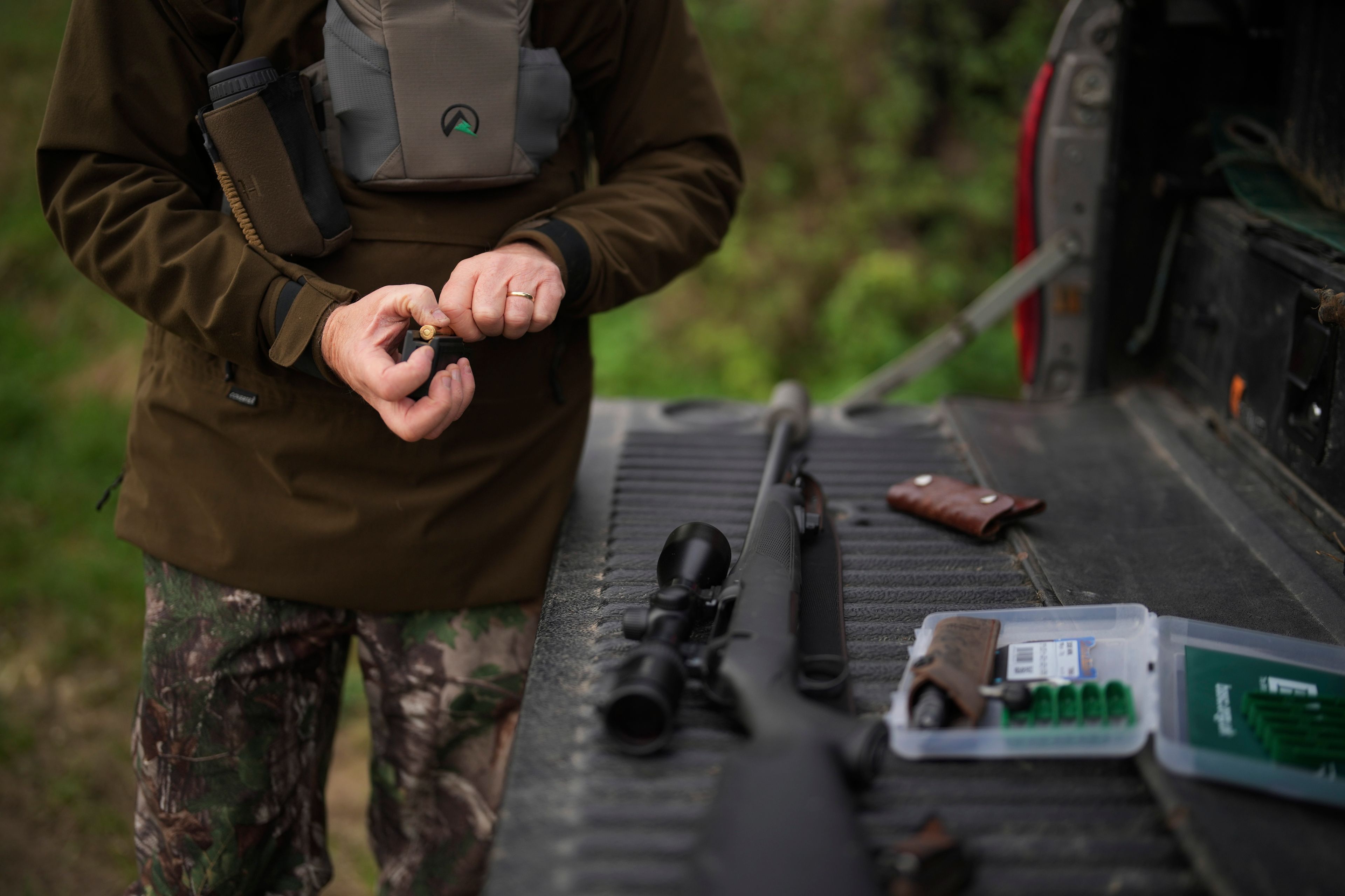 Martin Edwards, Head of Deer and Woodland Management at BASC (The British Association for Shooting and Conservation), loads a gun for hunting at Tichborne, east of Winchester in Hampshire, England, Monday, Nov. 4, 2024. Wild deer numbers have dramatically multiplied in recent decades and there are now more deer in England than at any other time in the last 1,000 years, according to the Forestry Commission, the government department looking after England's public woodland. (AP Photo/Kin Cheung)