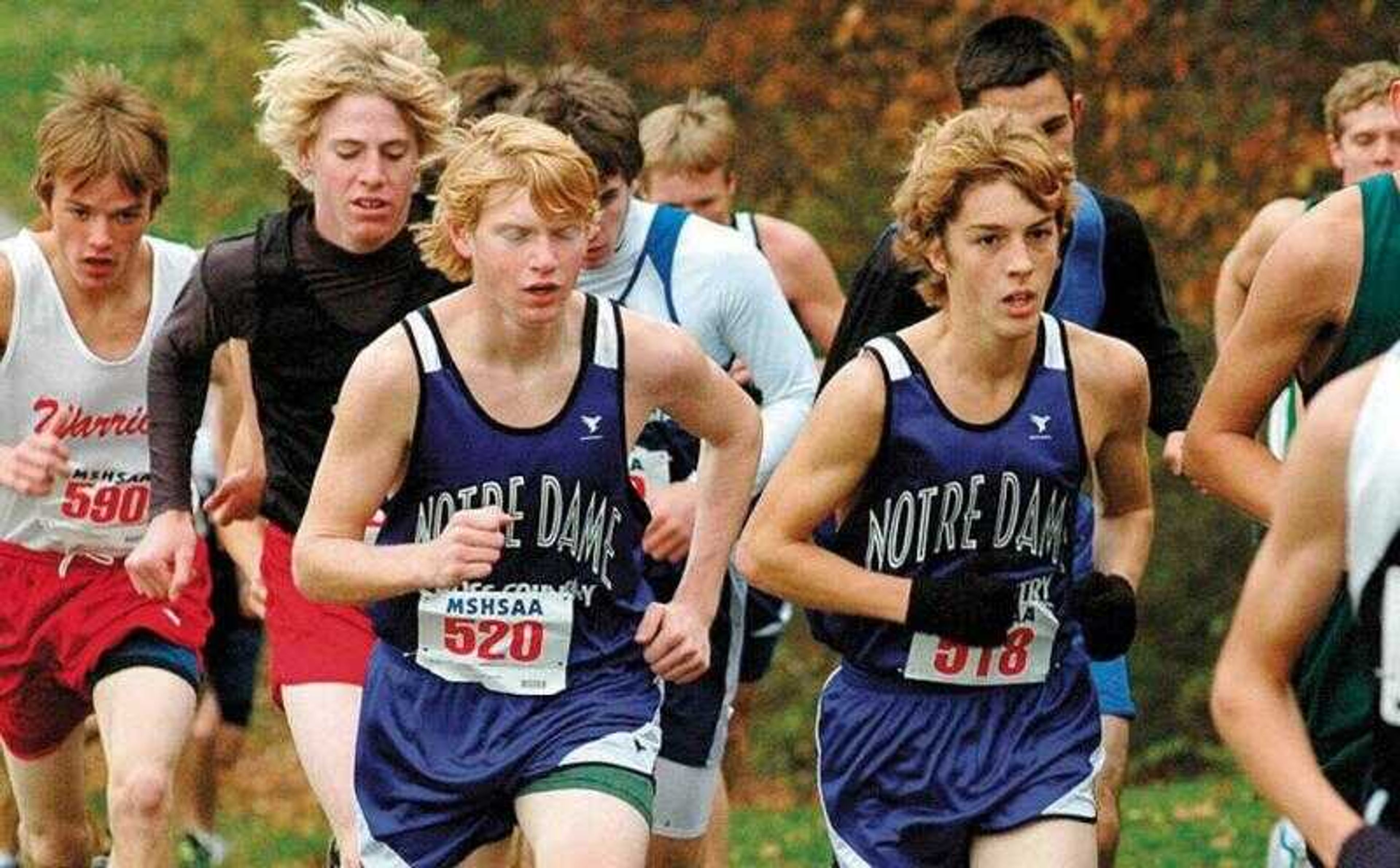 Notre Dame's Dillon Klaffer (520) and Logan Davis (518) ran with the pack Saturday during the Class 3 boys race at the state cross country meet in Jefferson City, Mo.