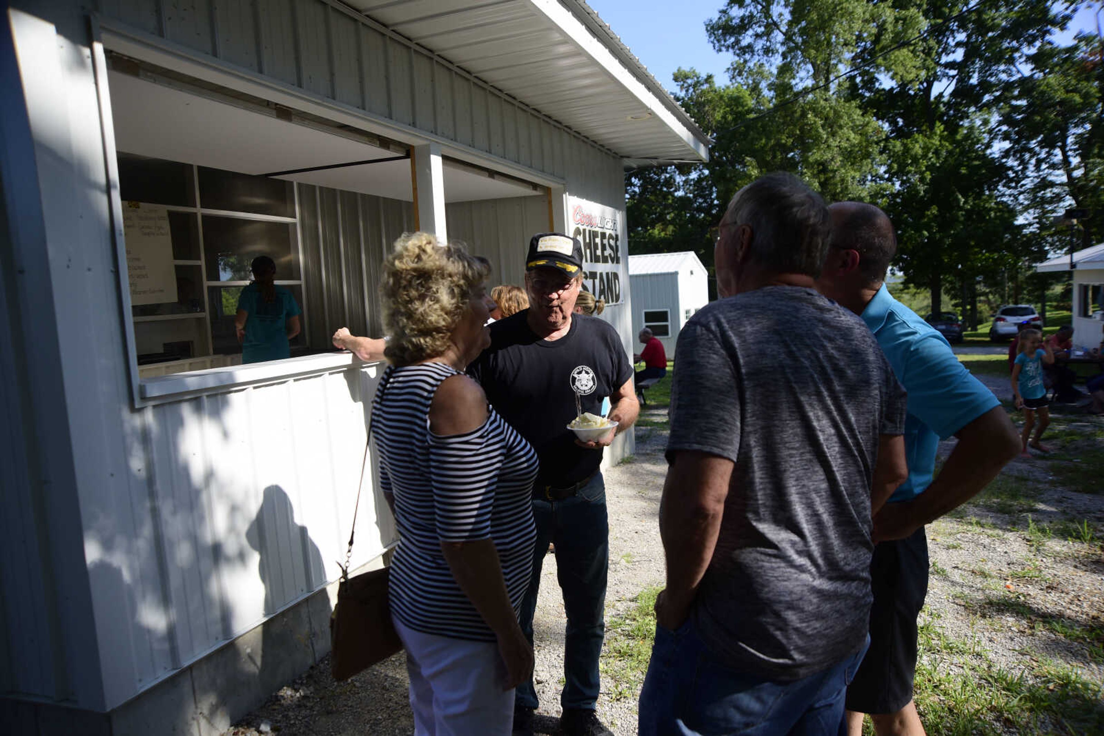 Carl Heise walks away with his coconut pie during the Trinity Church Picnic Sunday, July 16, 2017 at the Altenburg Fairgrounds.