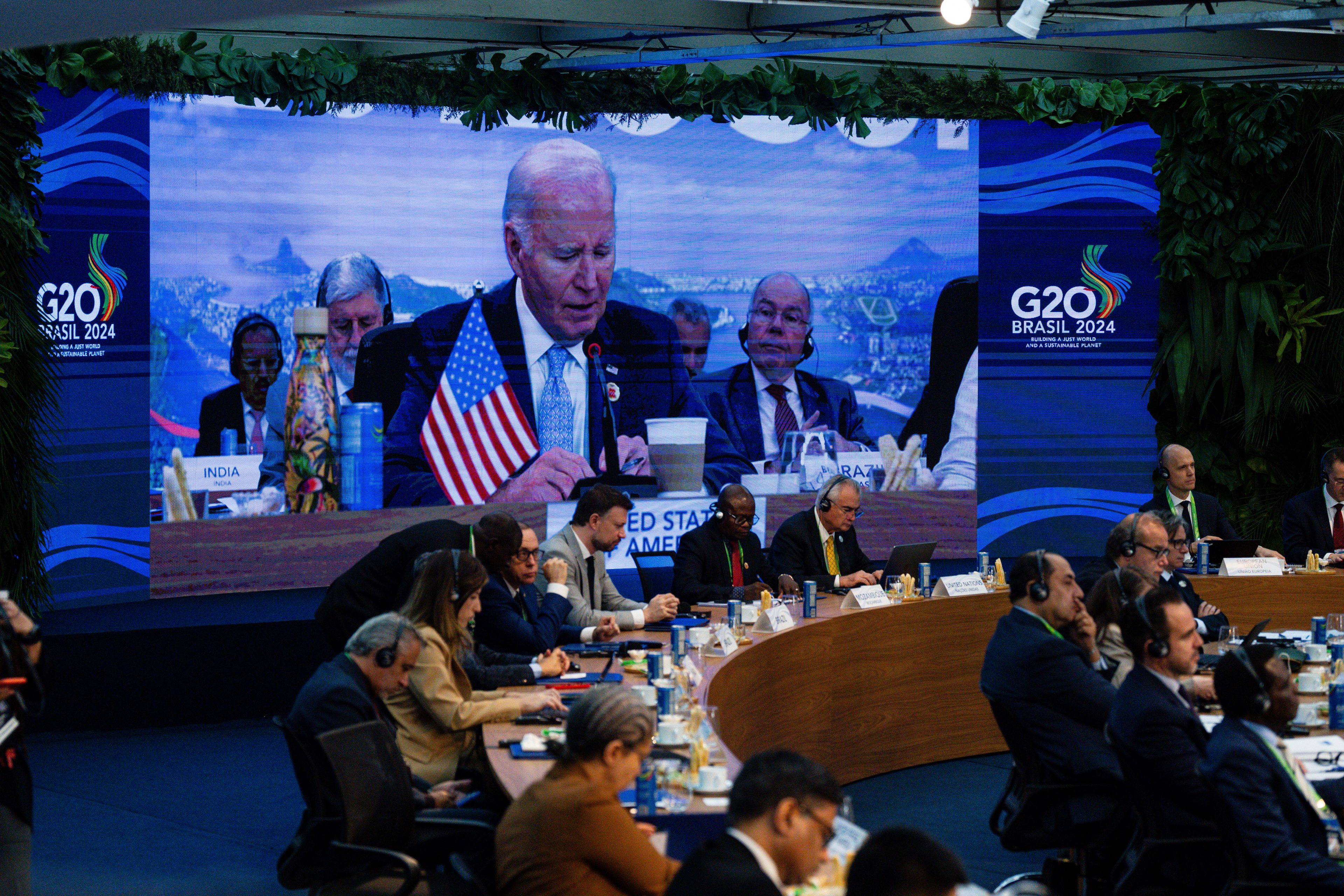 President Joe Biden, pictured on screen, speaks as other G20 leaders listen at the G20 Summit at the Museum of Modern Art in Rio de Janeiro, Brazil, Monday, Nov. 18, 2024. (Eric Lee/The New York Times via AP, Pool)