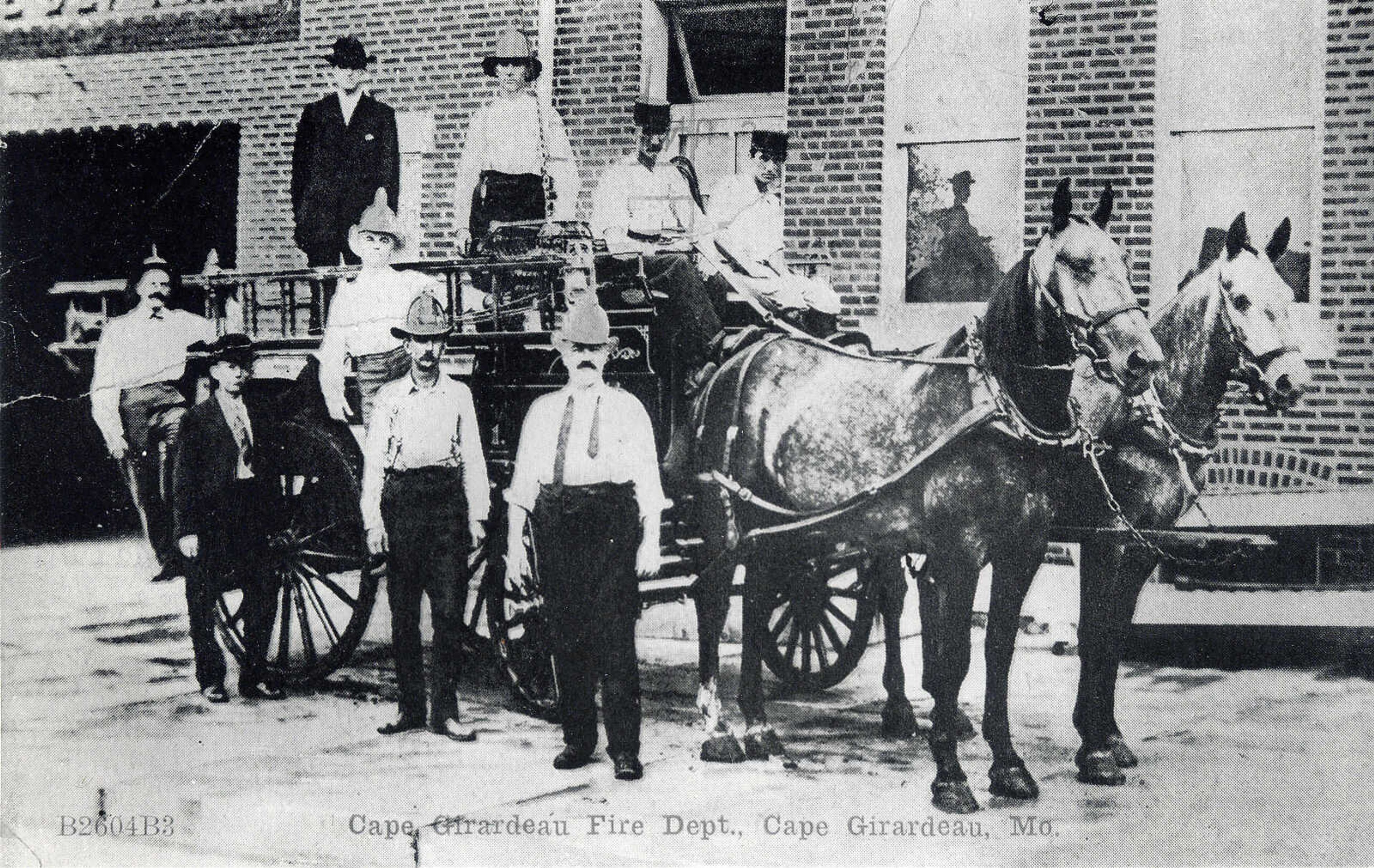 Pictured are members of the Cape Girardeau Fire Department. Barney Kraft (center of the picture standing) had been appointed Chief during the re-organization of the Department on May 5, 1909. First Assistant Chief was Charles Hahn and the Second Assistant Chief was Leon Albert. The dapple gray team of horses was purchased in St. Louis for $400 by Aldermen Alex Vasterling and Joe Wilson, hence their names Joe and Alex. They were trained by Leland Albert and were first hitched to the wagon May 25, 1909. They responded to their first call June 7, 1909.