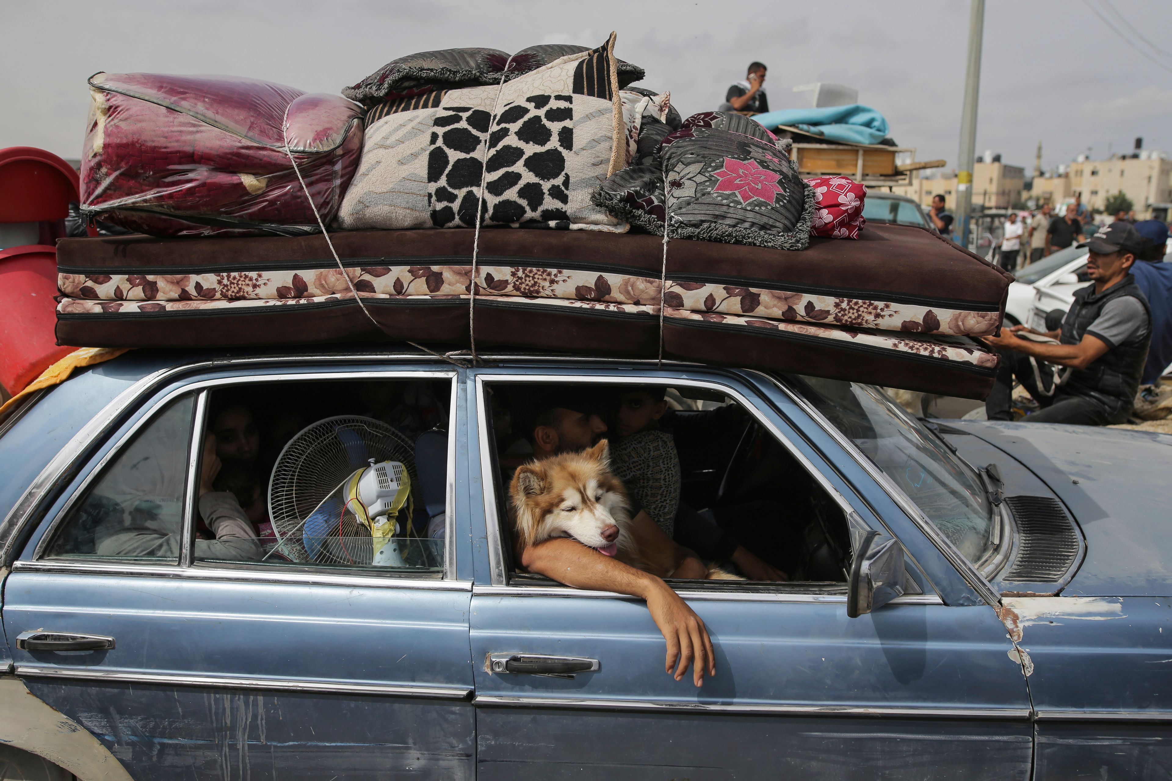 FILE - Palestinians flee from the southern Gaza city of Rafah during an Israeli ground and air offensive in the city on Tuesday, May 28, 2024. (AP Photo/Jehad Alshrafi, File)