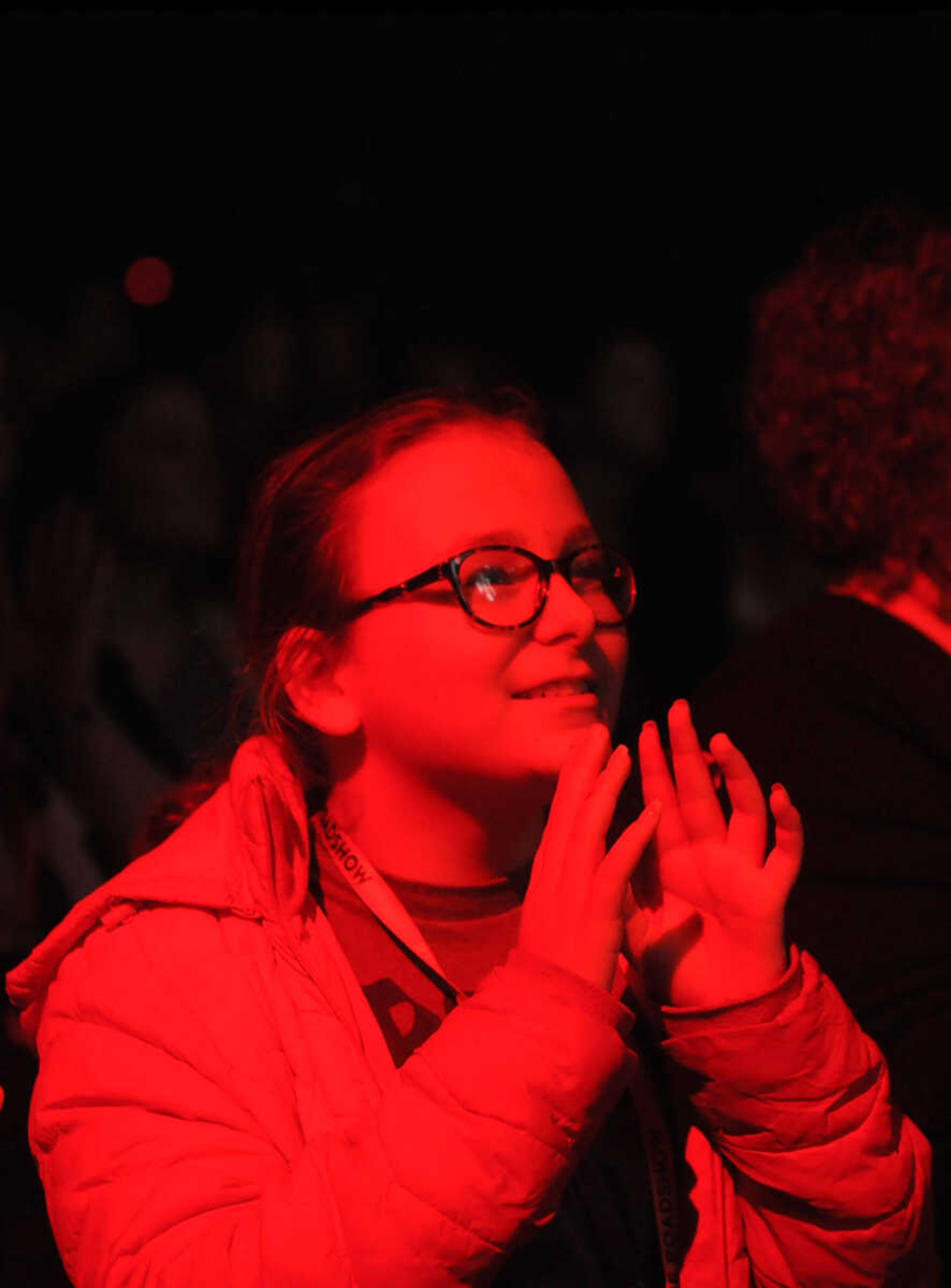 A young concert goer looks up at the stage eagerly as Bethel Music performs their set at The Roadshow on Thursday, Feb. 22, 2018, held at the Show Me Center in Cape Girardeau.