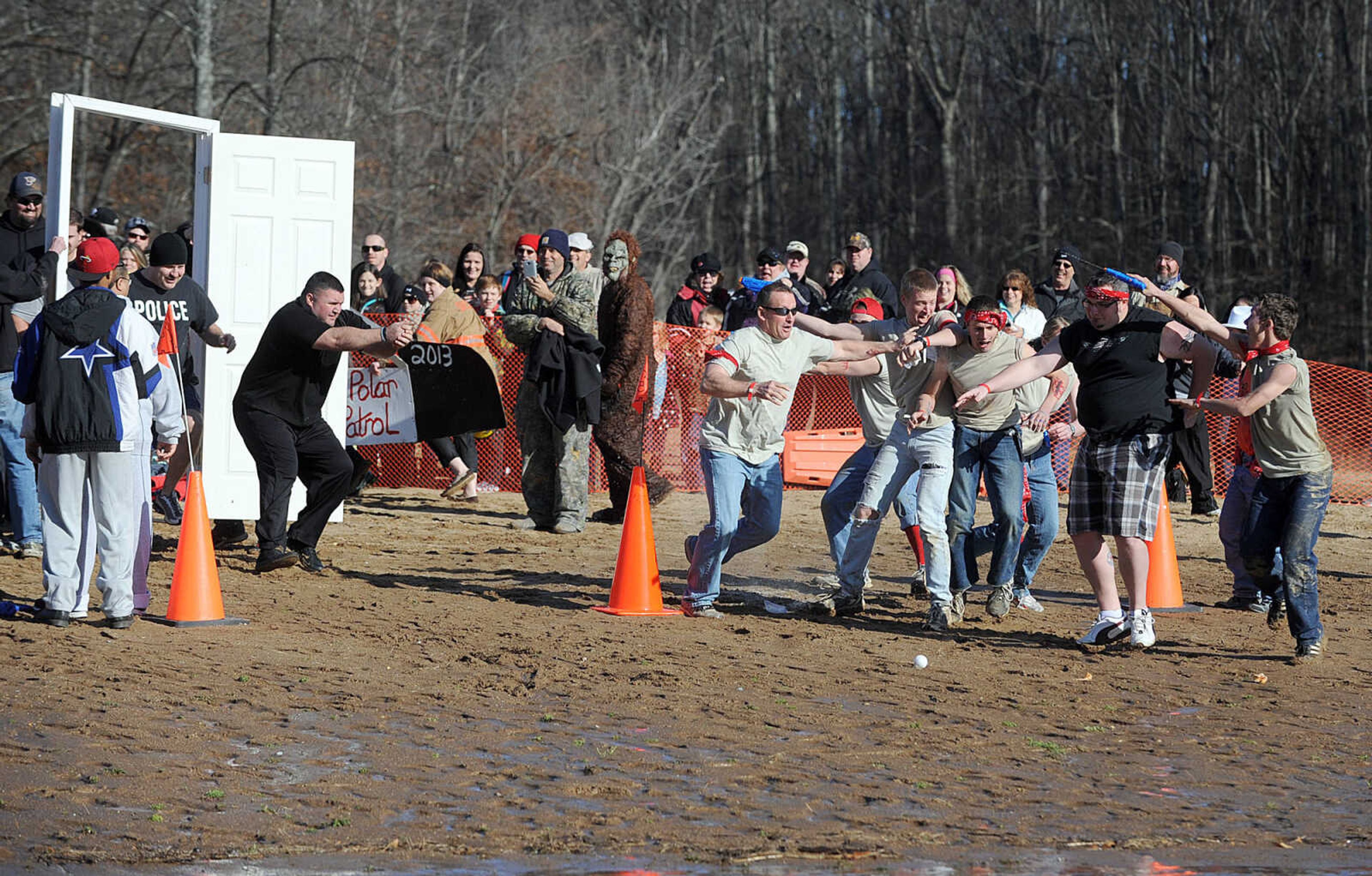 LAURA SIMON ~ lsimon@semissourian.com
People plunge into the cold waters of Lake Boutin Saturday afternoon, Feb. 2, 2013 during the Polar Plunge at Trail of Tears State Park. Thirty-six teams totaling 291 people took the annual plunge that benefits Special Olympics Missouri.