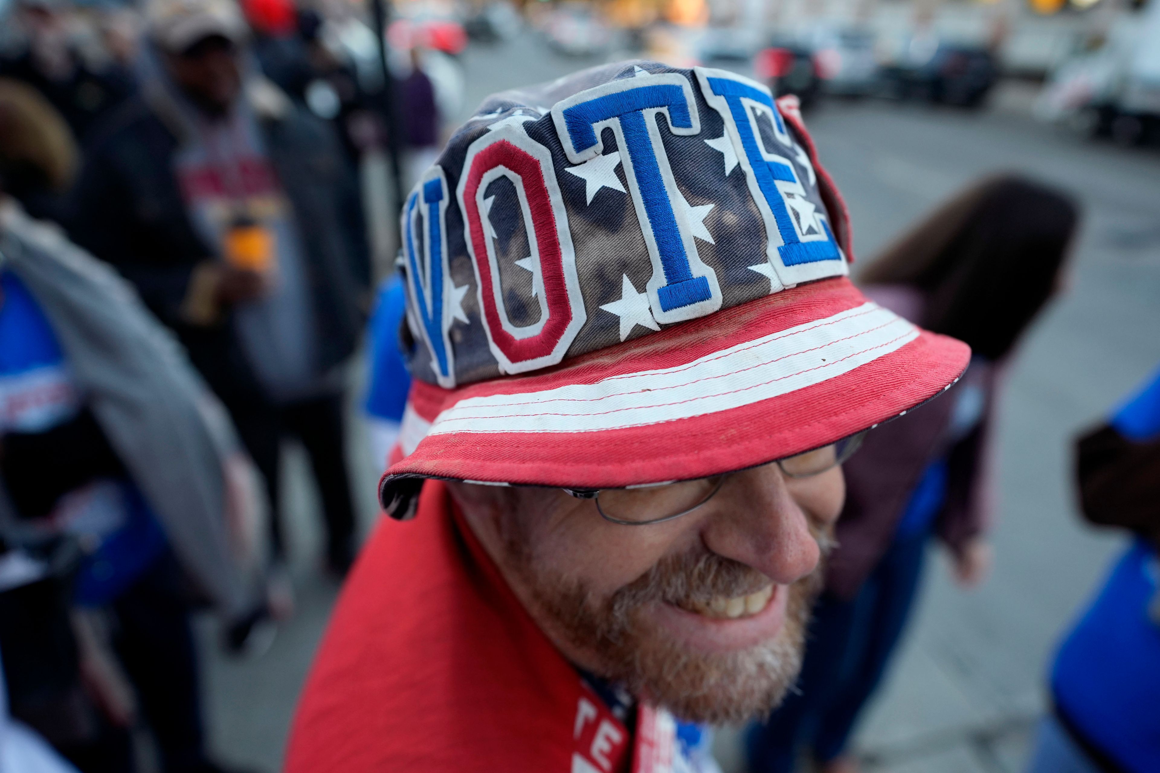 John Olsen, of Ankeny, Iowa, waits in line for early voting at the Polk County Election Office, Wednesday, Oct. 16, 2024, in Des Moines, Iowa. (AP Photo/Charlie Neibergall)