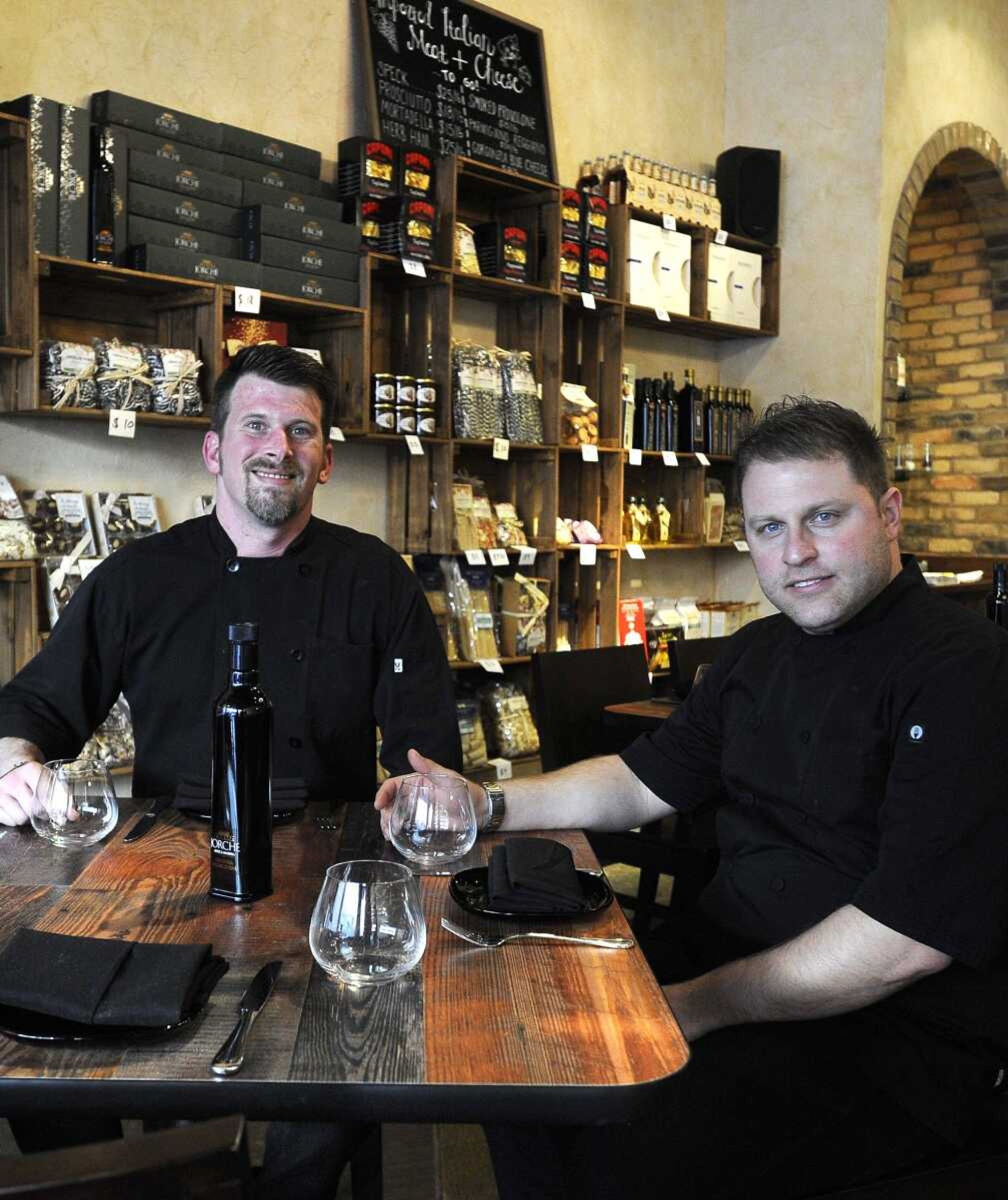 Jeremy Bourland, left, and Gabriele Ruggieri pose for a photo in the dining area Friday at Gabriel's Food + Wine, 127 N. Main St. in Cape Girardeau.