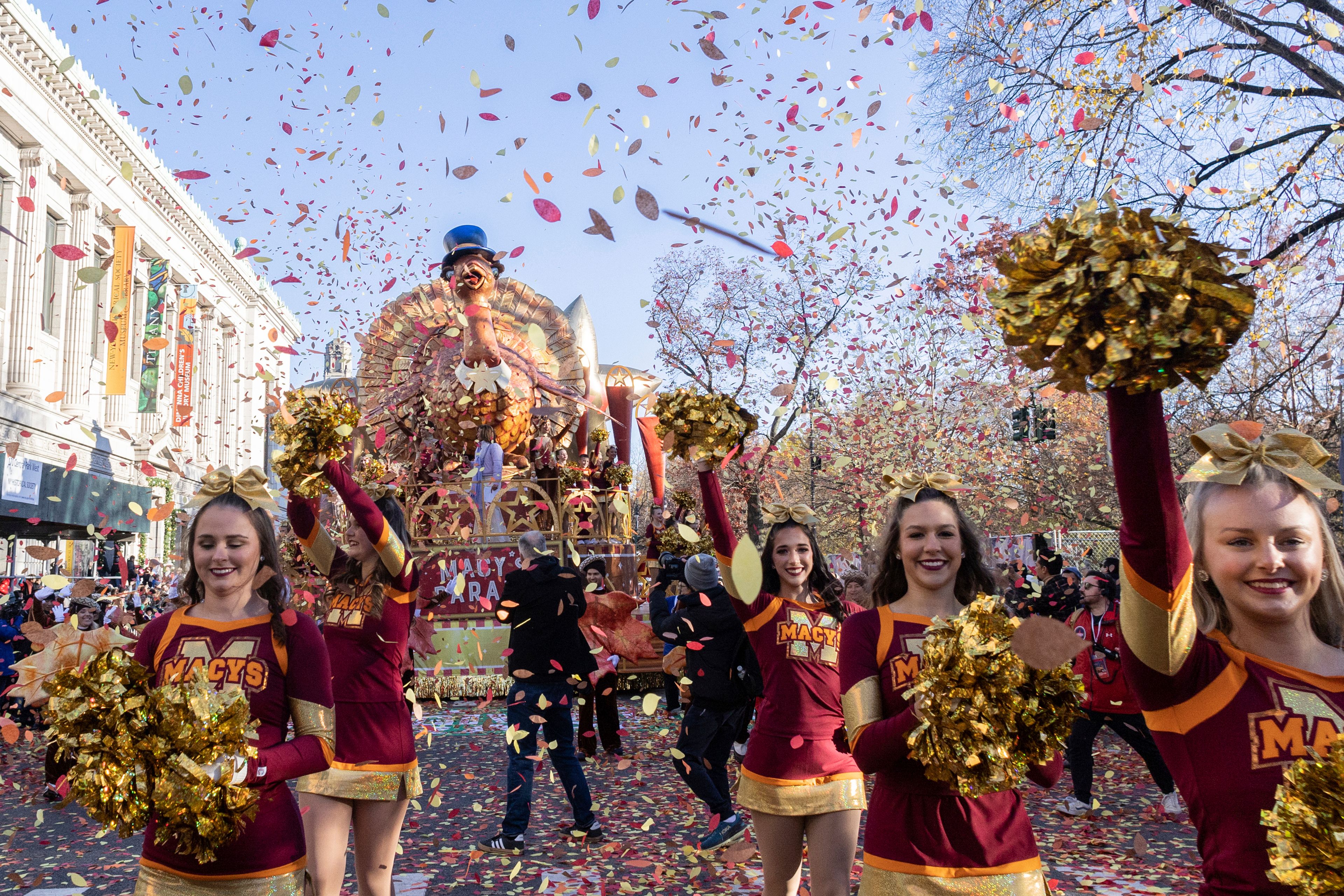 FILE - Performers lead the Tom Turkey float down Central Park West at the start of the Macy's Thanksgiving Day parade, Thursday, Nov. 23, 2023, in New York. (AP Photo/Jeenah Moon, File)