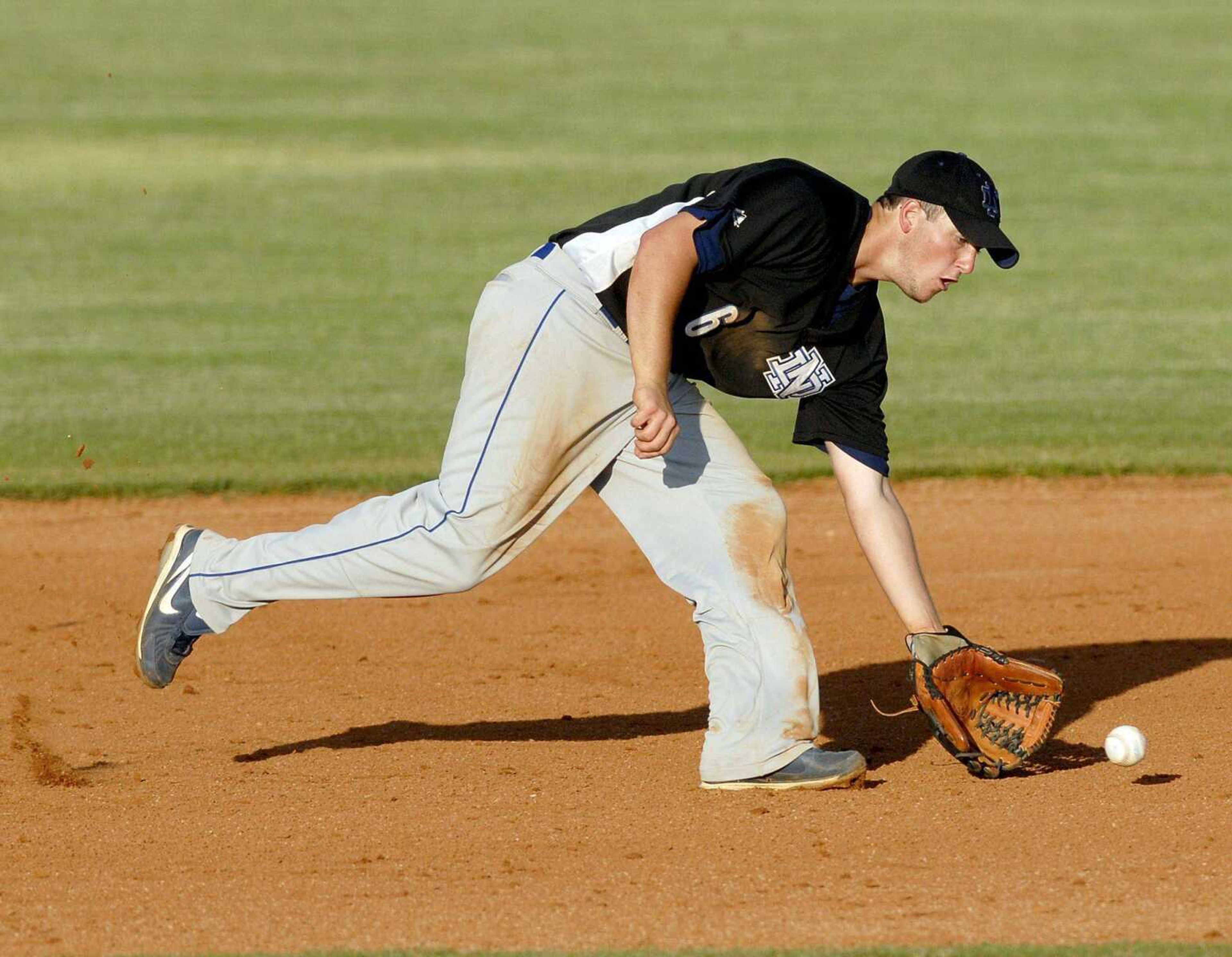 Notre Dame's Dylan Drury fields a grounder during the Bulldogs' Class 3 state semifinal game. (Elizabeth Dodd)