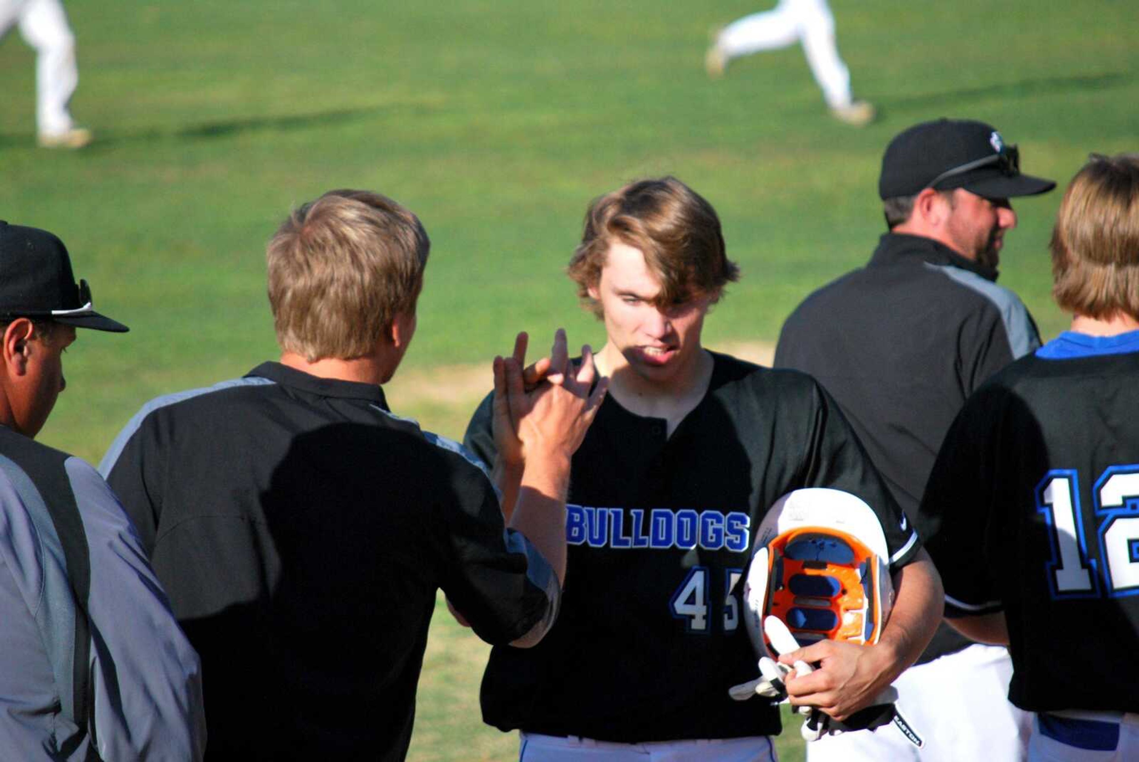 Notre Dame's Dean Crippen is congratulated by teammates after hitting a two-run double in the bottom of the sixth inning to give the Bulldogs a 15-5 win over Perryville in the Class 4 District 1 championship Thursday in Doniphan, Missouri. (Trent Singer)