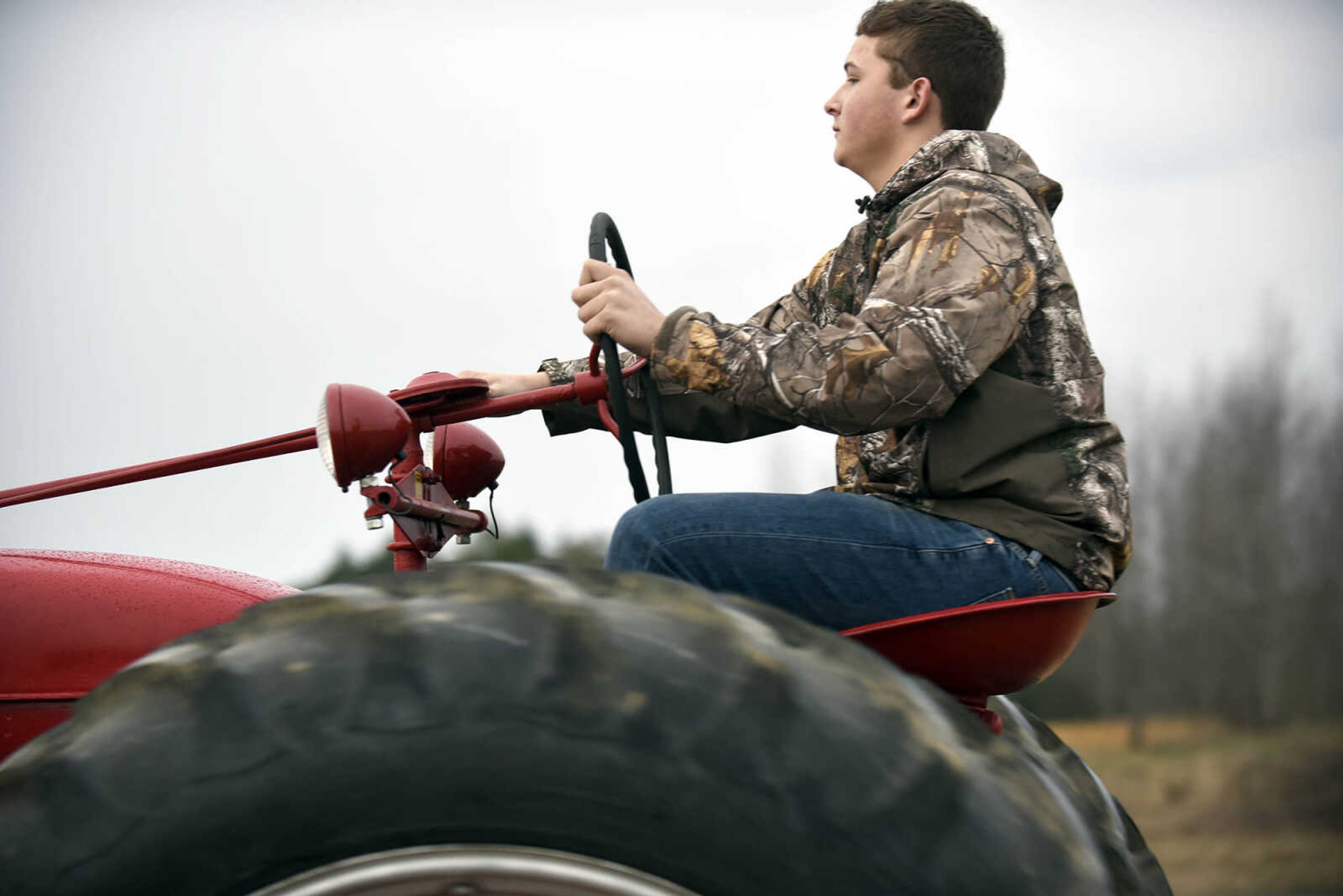 Saxony Lutheran High School FFA students take to the road on their tractors during drive your tractor to school day on Tuesday morning, Feb. 21, 2017. Students began their journey to school from Davis Farm Supply on Highway 61 in Jackson as part of FFA Week.