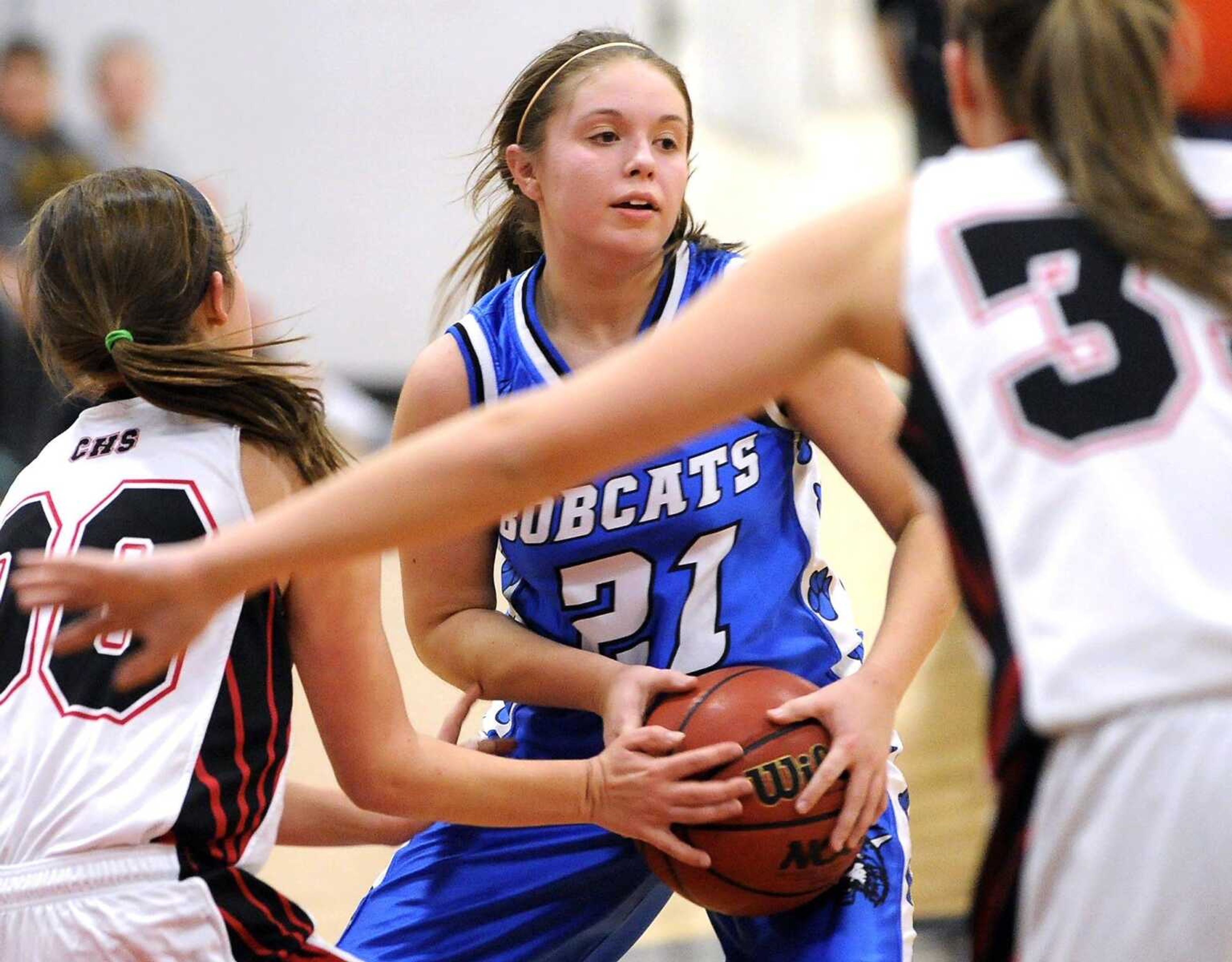 Delta's Lydia Borneman looks to pass while guarded by Chaffee's Bailey Wiseman and Mattison Cline during the second quarter of a first-round game in the Scott-Mississippi Conference Tournament on Tuesday, Jan. 12, 2016 in Chaffee, Missouri. (Fred Lynch)