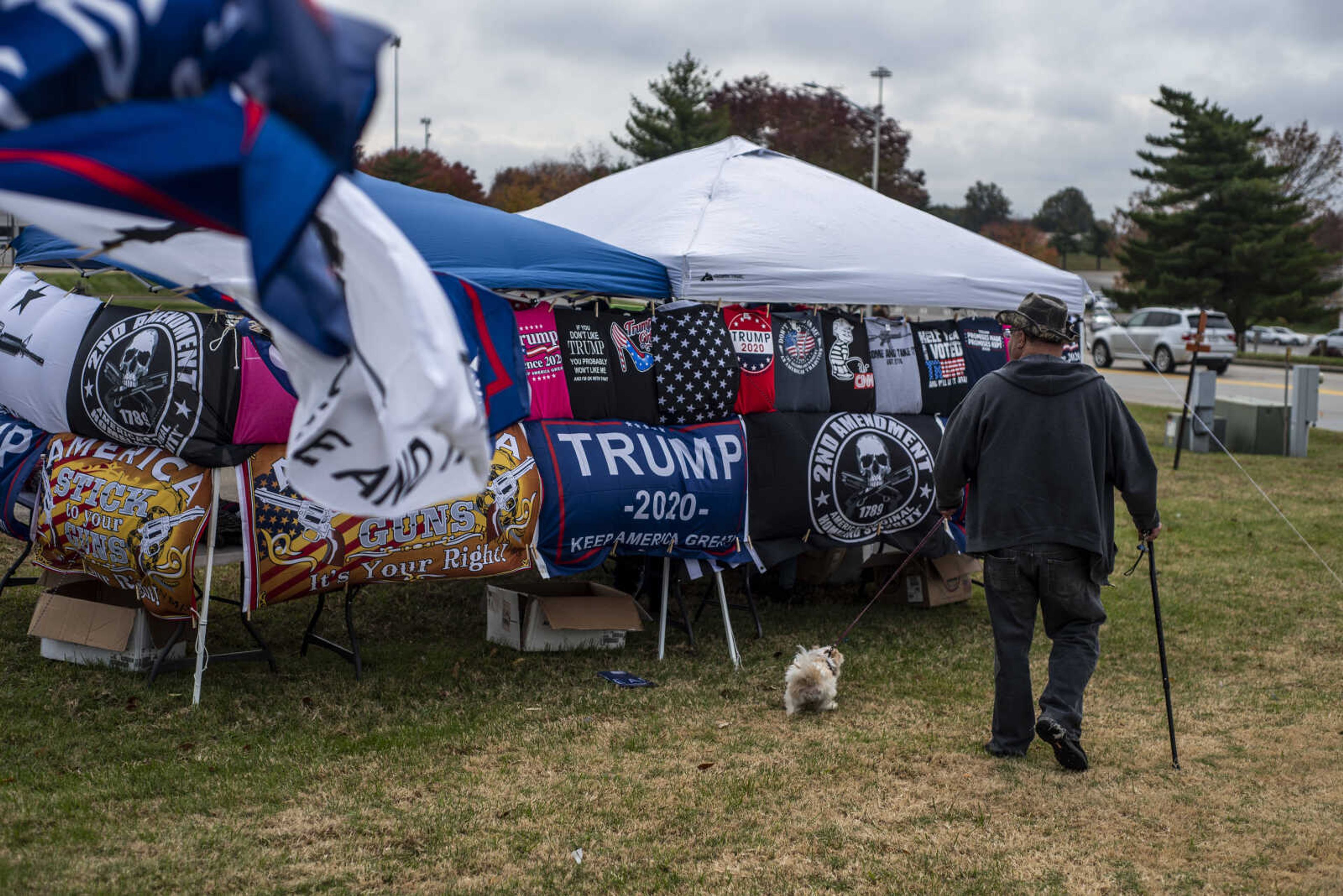 A Donald Trump supporter checks out the merchandise available for sale at a booth near West Park Mall Monday, Nov. 5, 2018, in Cape Girardeau.