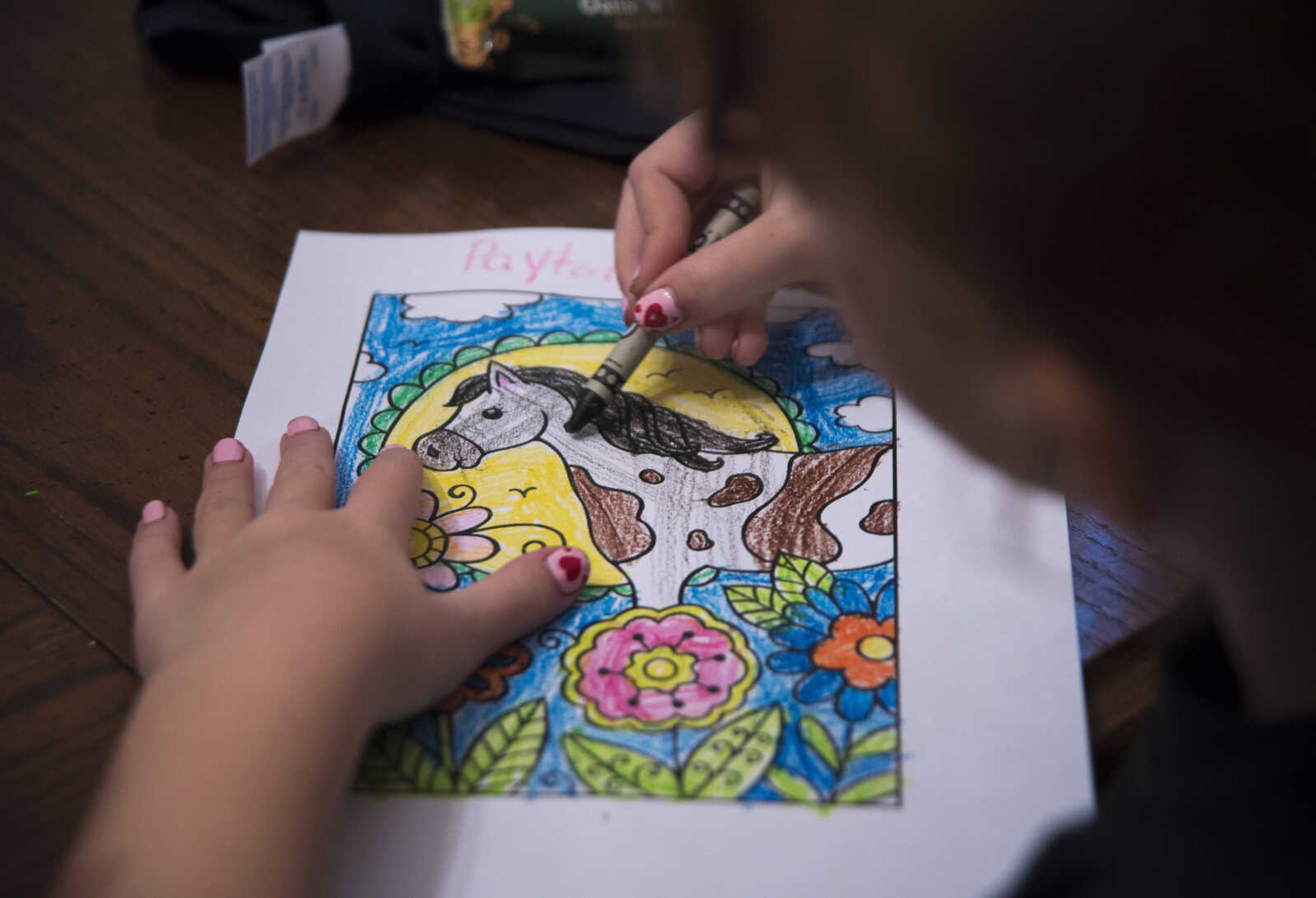 Payton Lynch, 6, colors a horse during the Rolling Hills Youth Day Camp Wednesday, June 7, 2017 in Cape Girardeau.