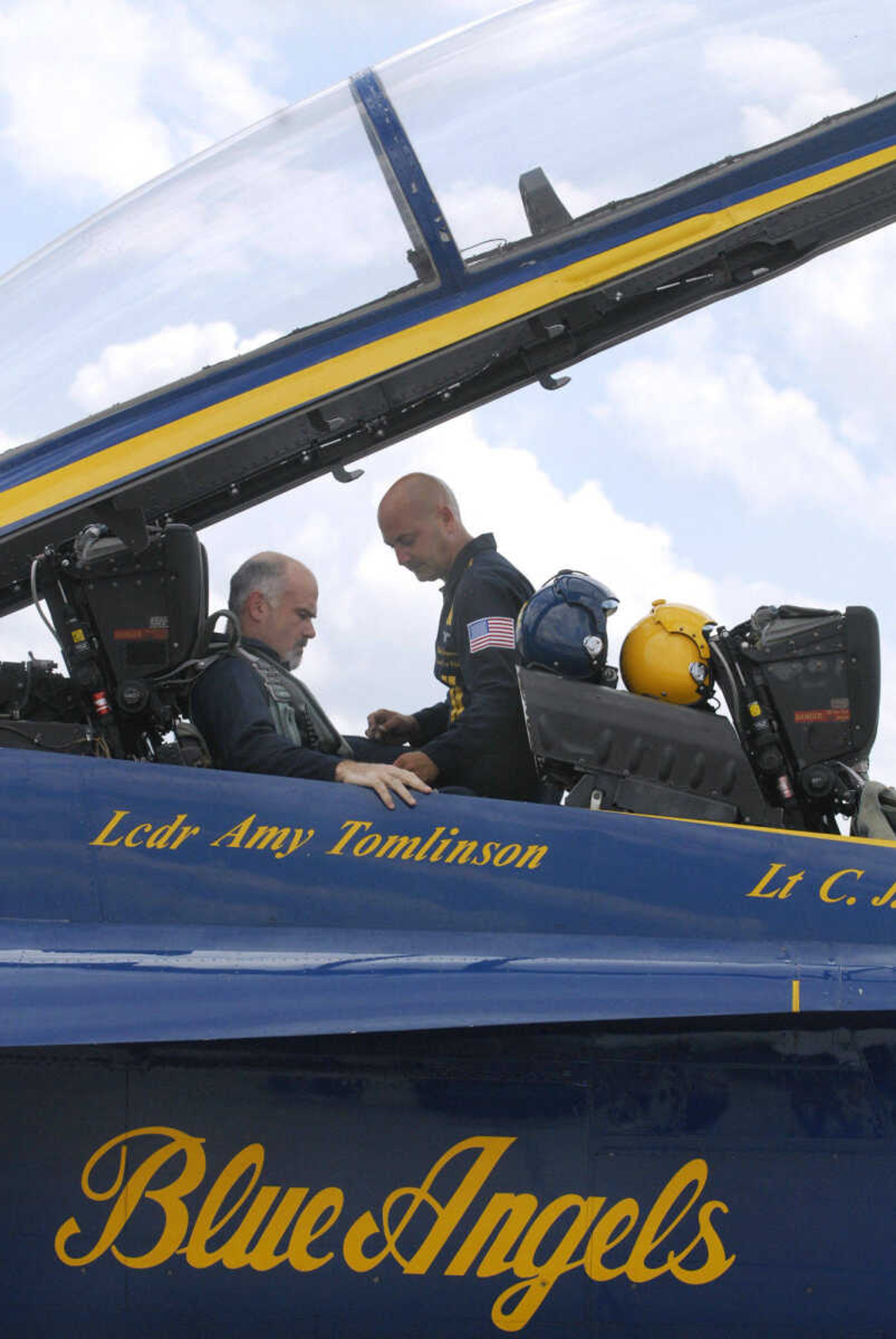 KRISTIN EBERTS ~ keberts@semissourian.com

Neil Berry, left, gets buckled in the Blue Angels' F/A-18 with the help of #7 Crew Chief Chad Swanson at the Cape Girardeau Airport on Wednesday, June 16, 2010. Berry was one of three area people who got the chance to fly with the Blue Angels on Wednesday.