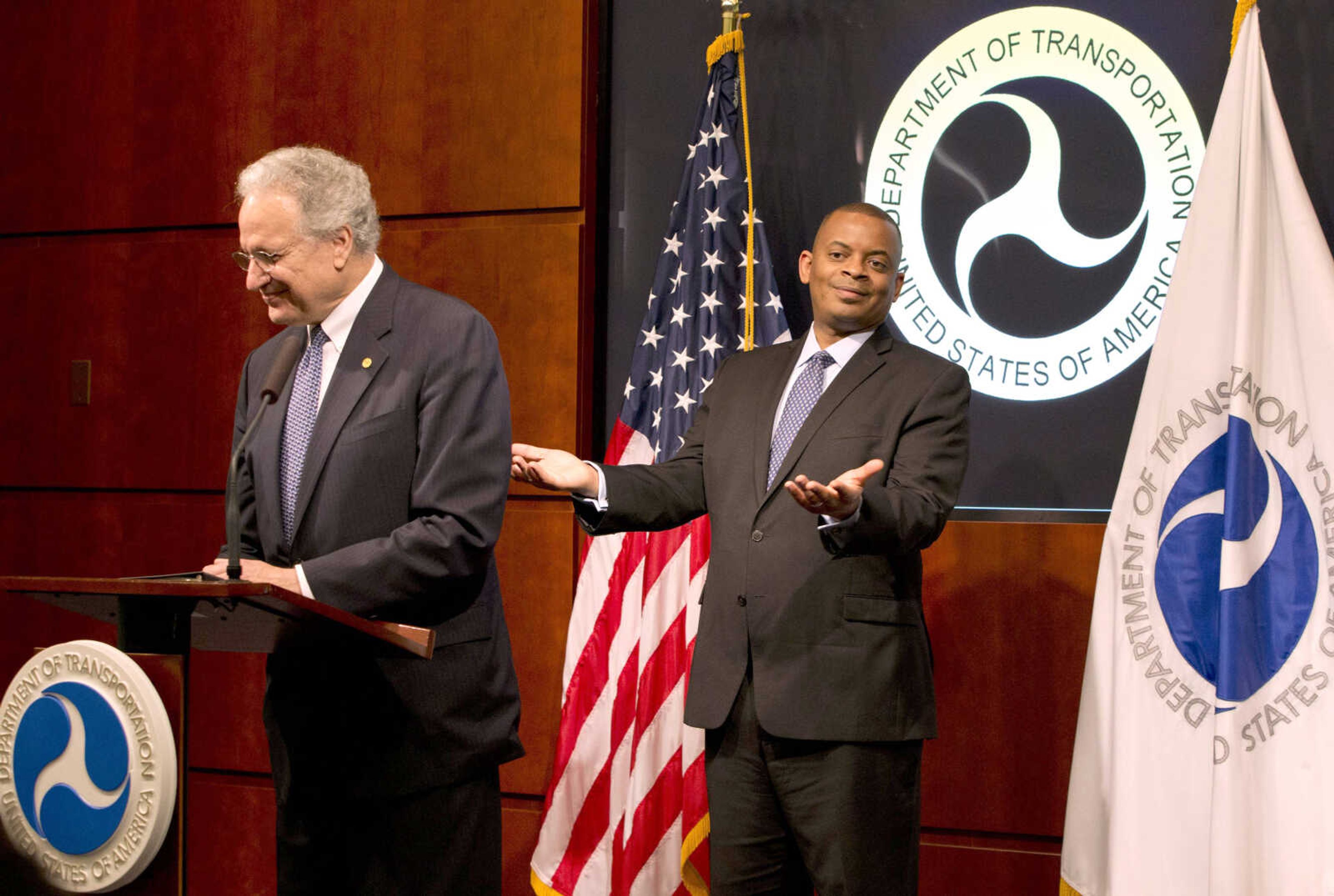 Transportation Secretary Anthony Foxx gestures behind NHTSA administrator Mark Rosekind during a news conference to talk about the Takata air bag inflator recall Tuesday at the Transportation Department in Washington. (Jacquelyn Martin ~ Associated Press)