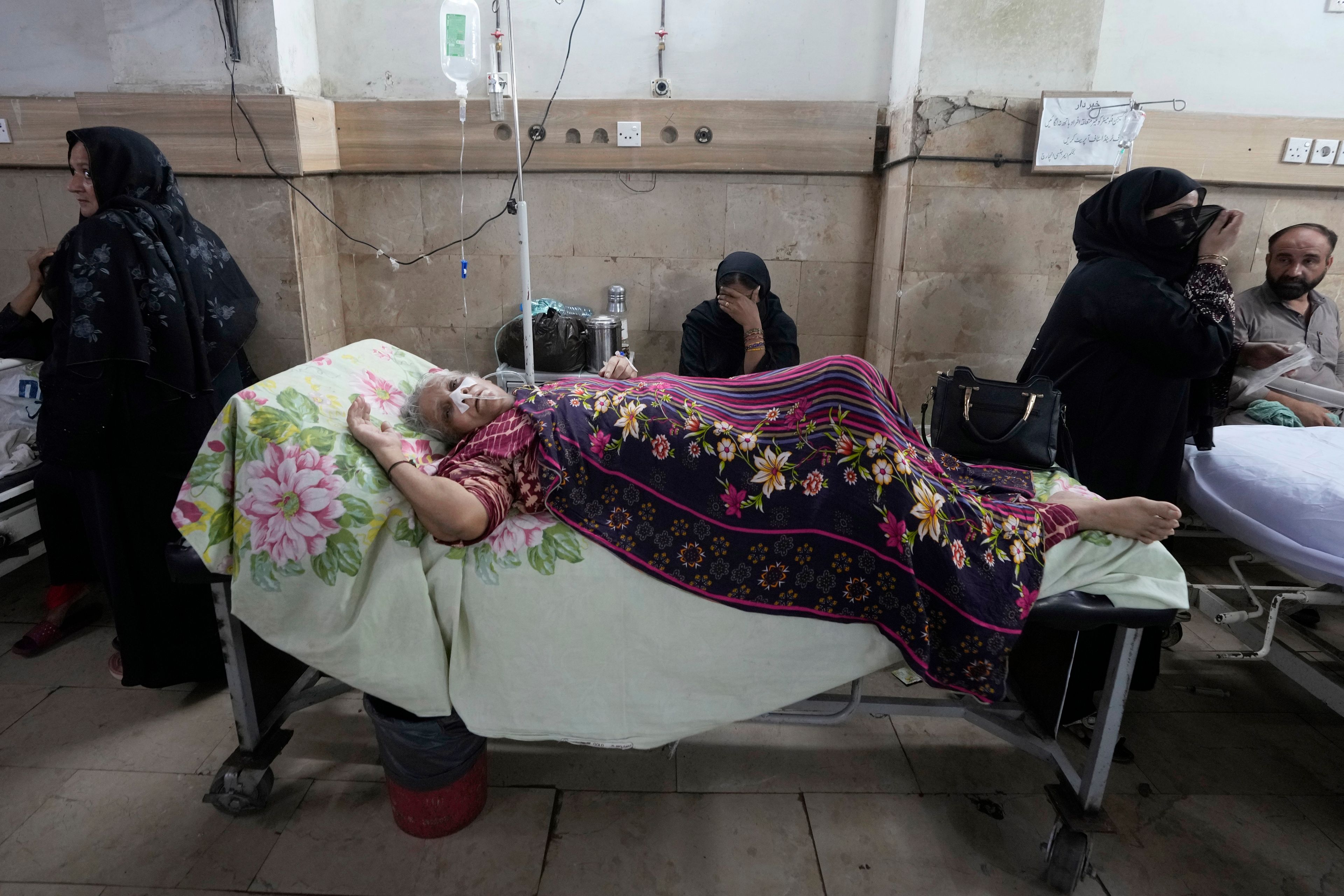 FILE - A patient suffering from heatstroke receives treatment at a hospital in Karachi, Pakistan, June 25, 2024. (AP Photo/Fareed Khan, File)